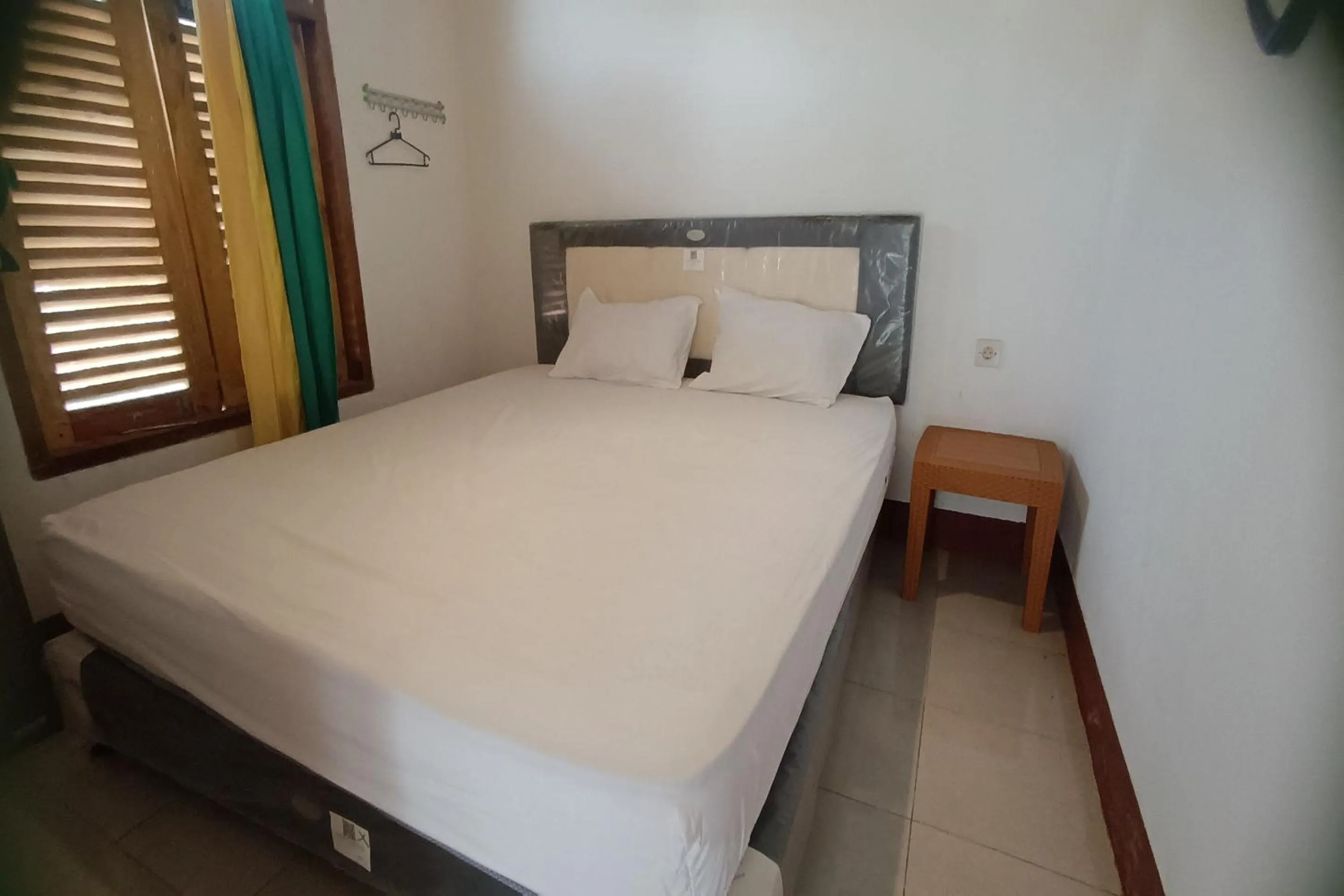 Bedroom in OYO 93626 Hi Homestay & Group