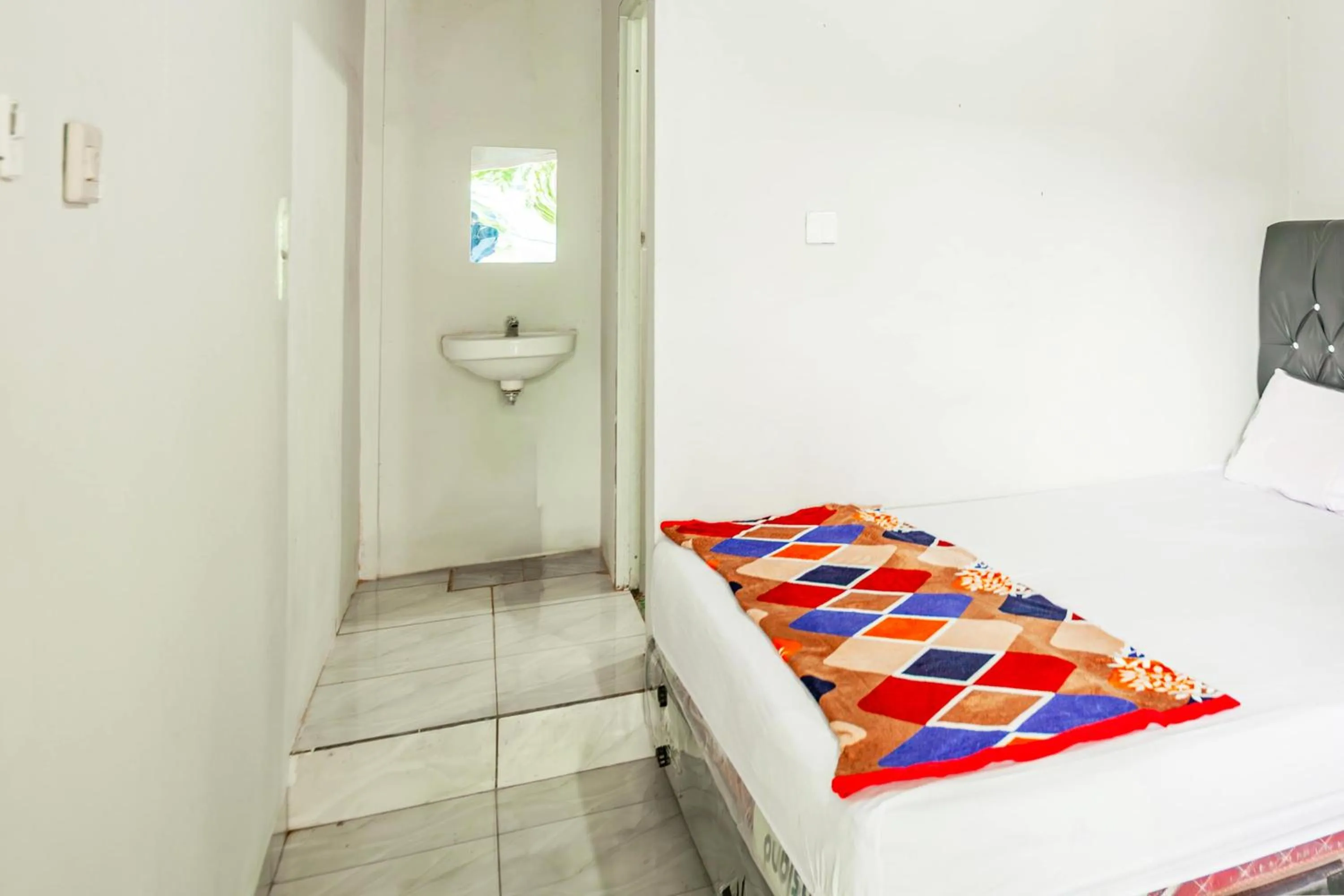 Bedroom in Hotel O Wongso Residence Syariah