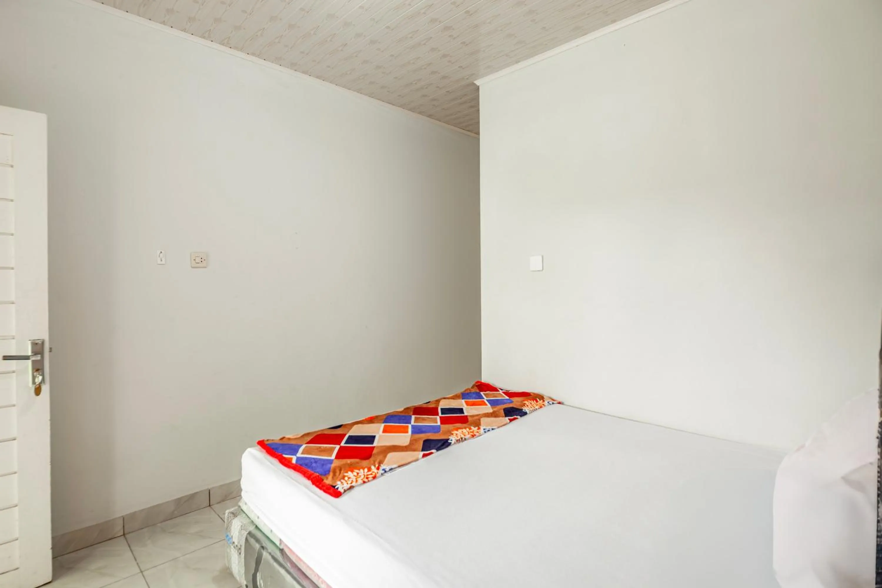 Bedroom in Hotel O Wongso Residence Syariah