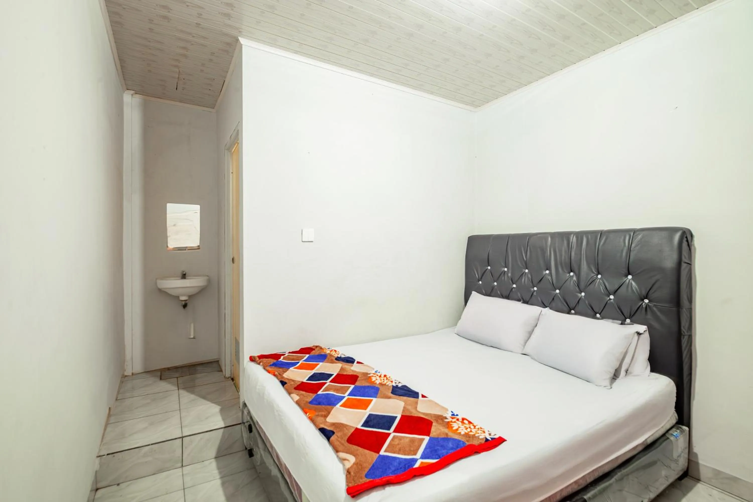 Bedroom in Hotel O Wongso Residence Syariah