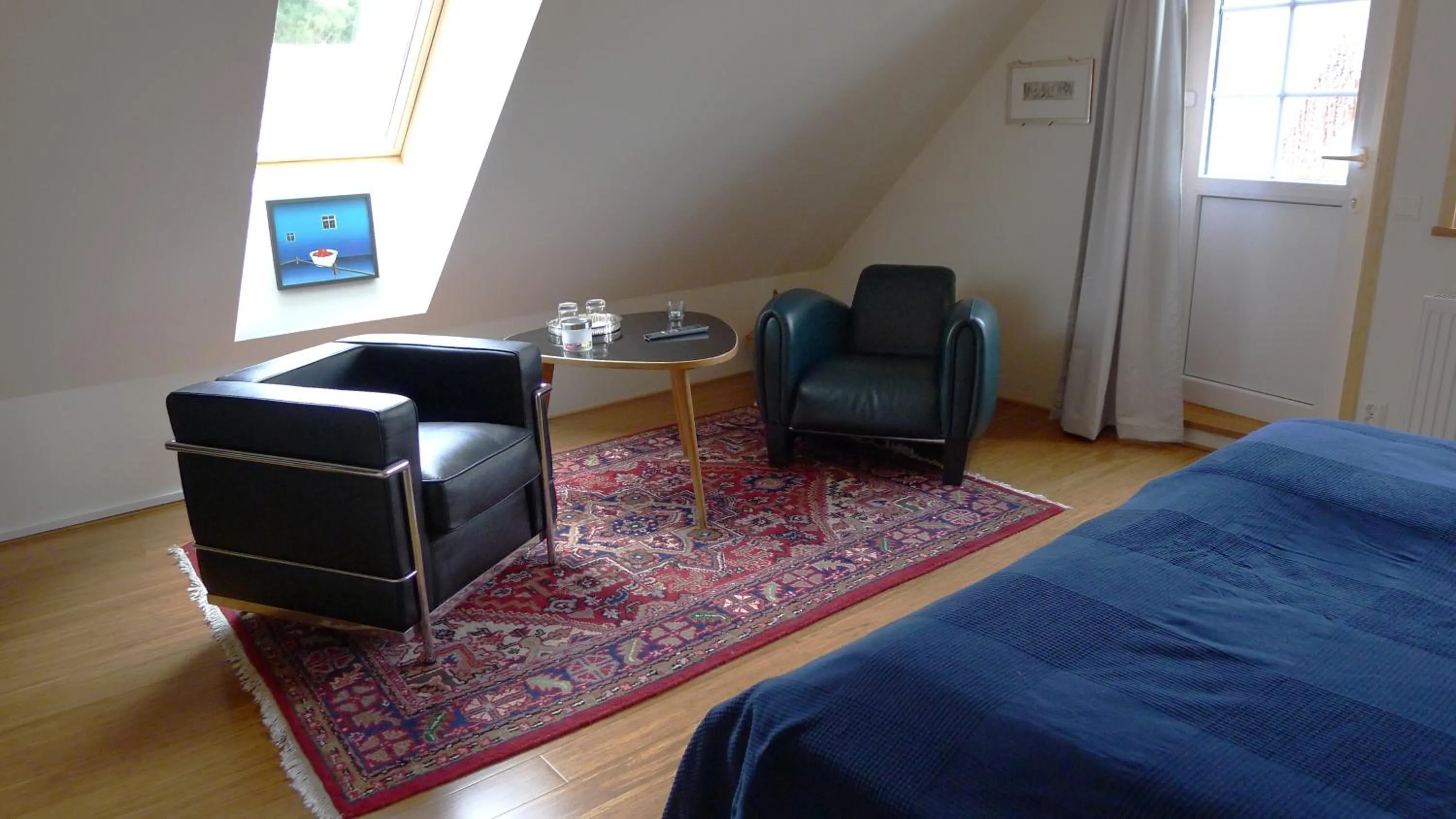 Seating area, Bed in Lilla Trulla Gårdshotell - Feels like home