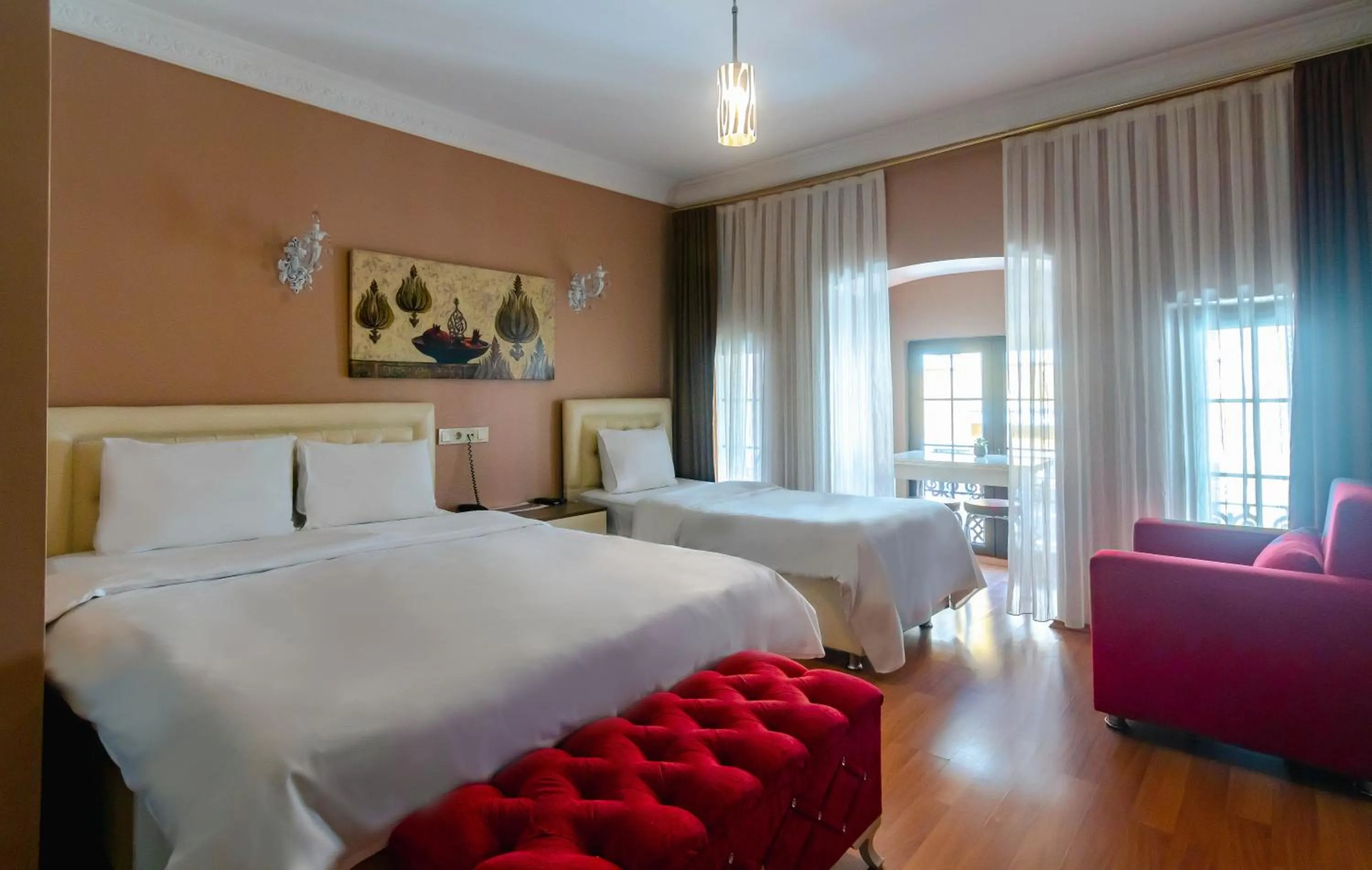 Bed in Zendy Suite Hotel