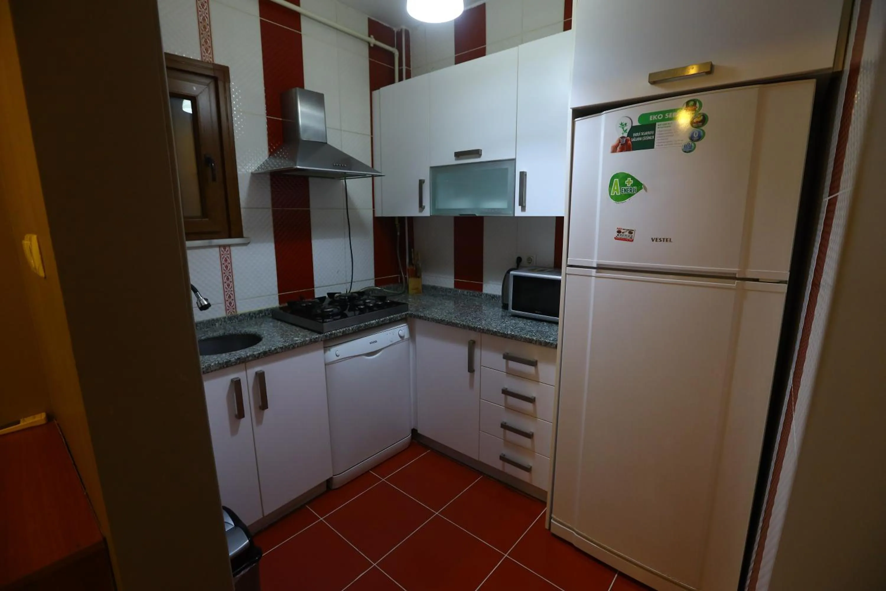 kitchen in Zendy Suite Hotel