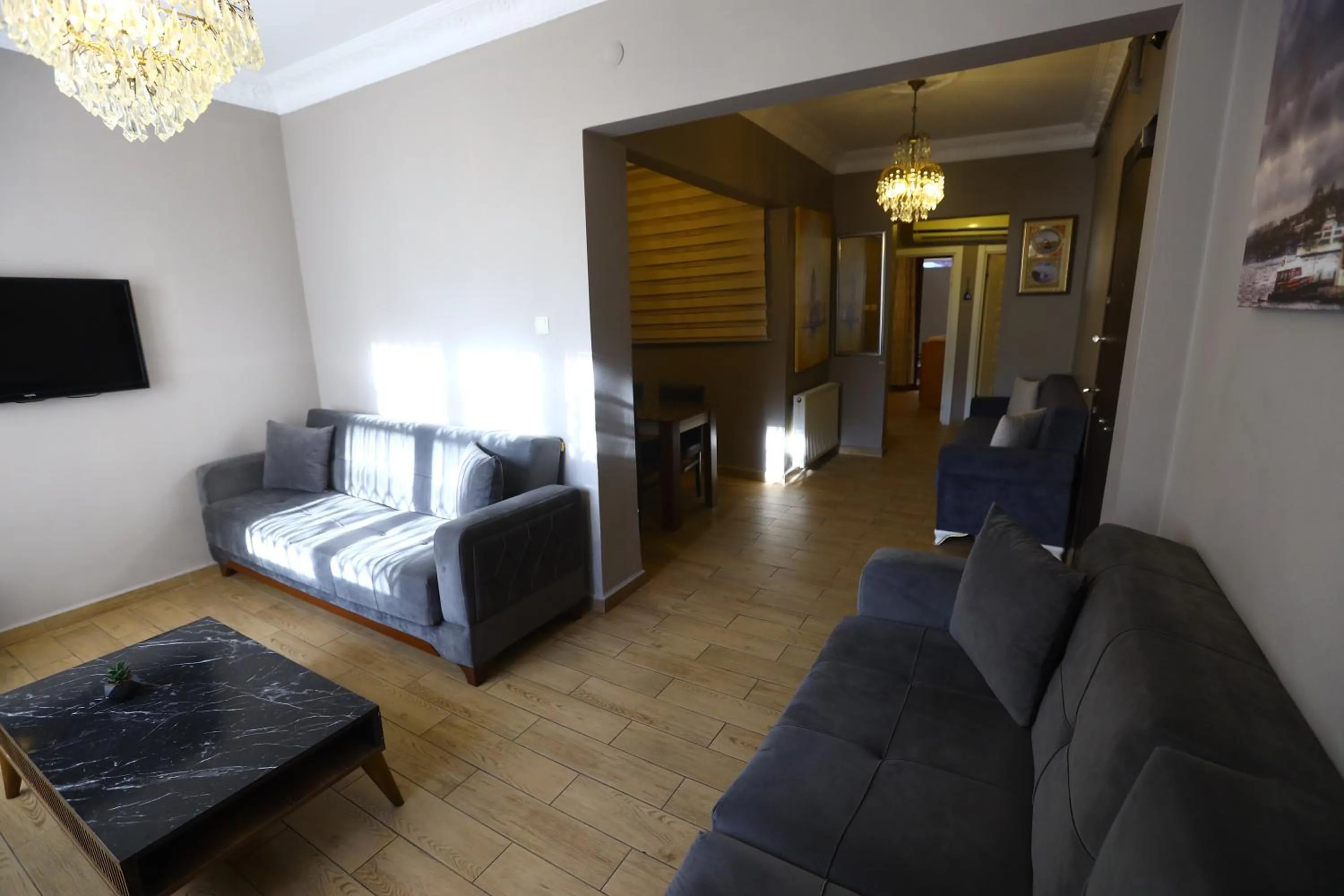 Communal lounge/ TV room, Bed in Zendy Suite Hotel