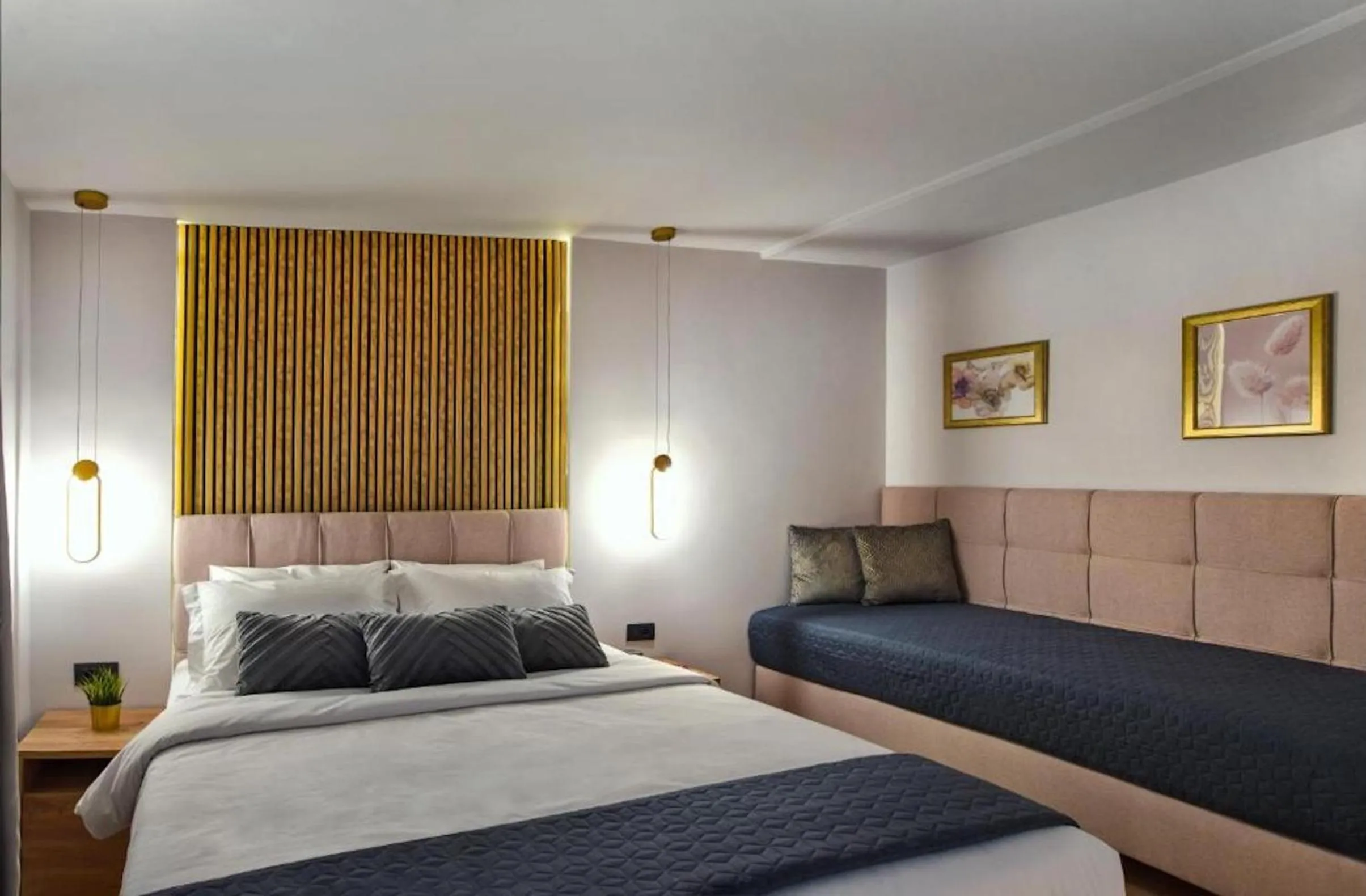 Bed in CITYLUXE Suites & Rooms