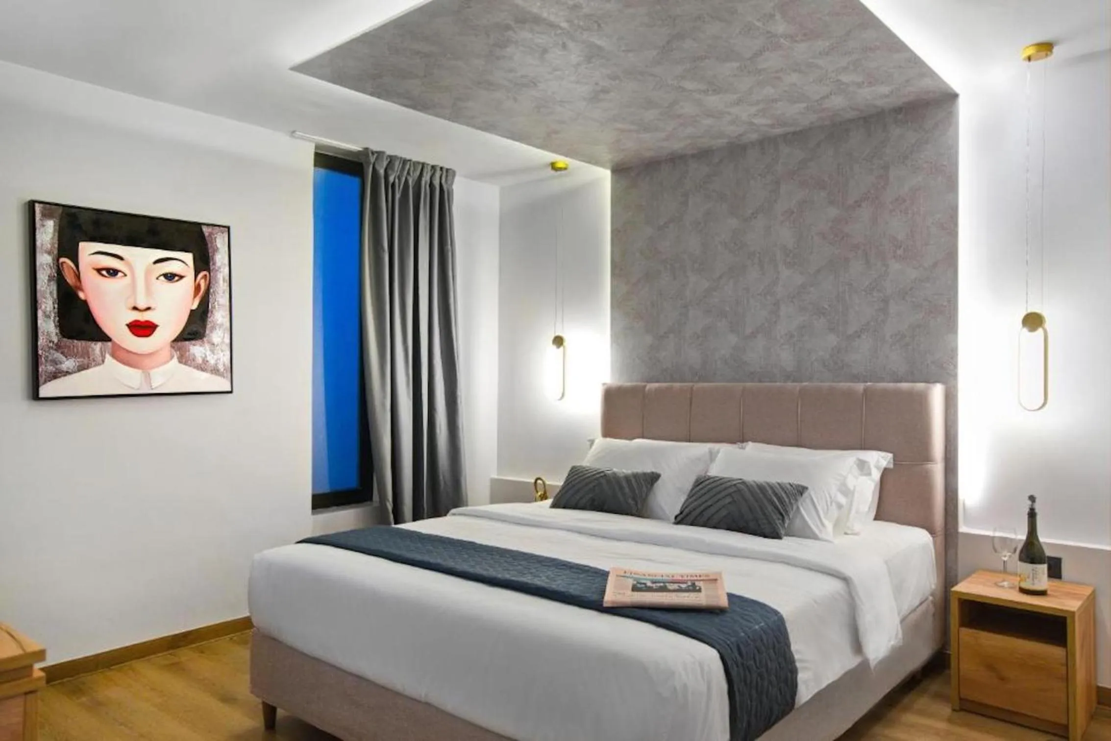 Bed in CITYLUXE Suites & Rooms