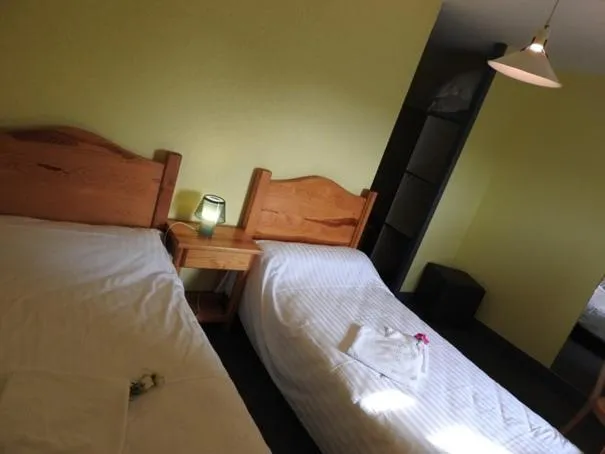 Bed in AUX GLOBE-TROTTERS