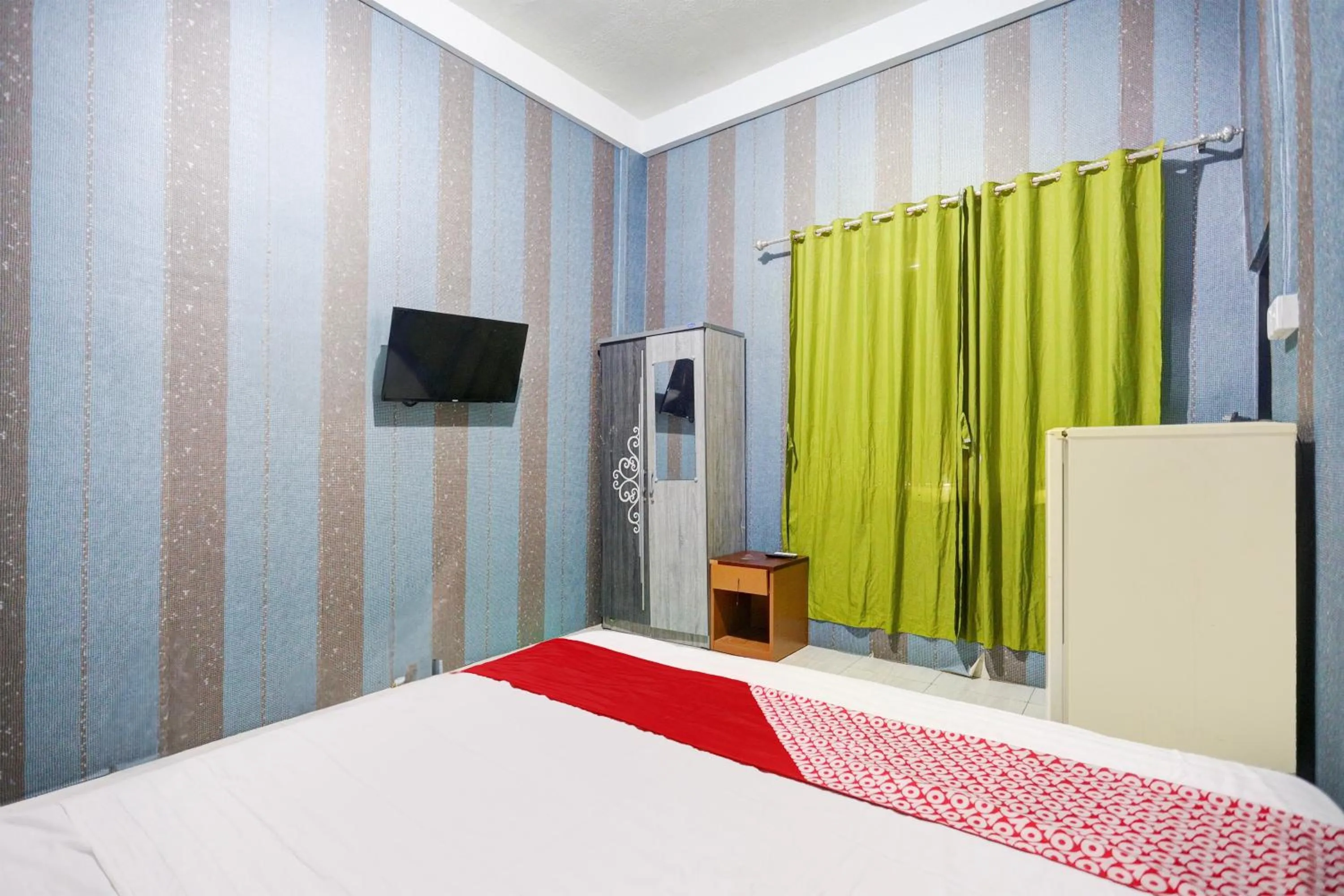 Bedroom, Bed in Hotel O Penginapan Pelangi