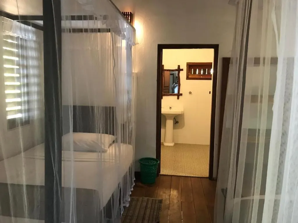 Bed in Ganesh Garden Beach Cabanas