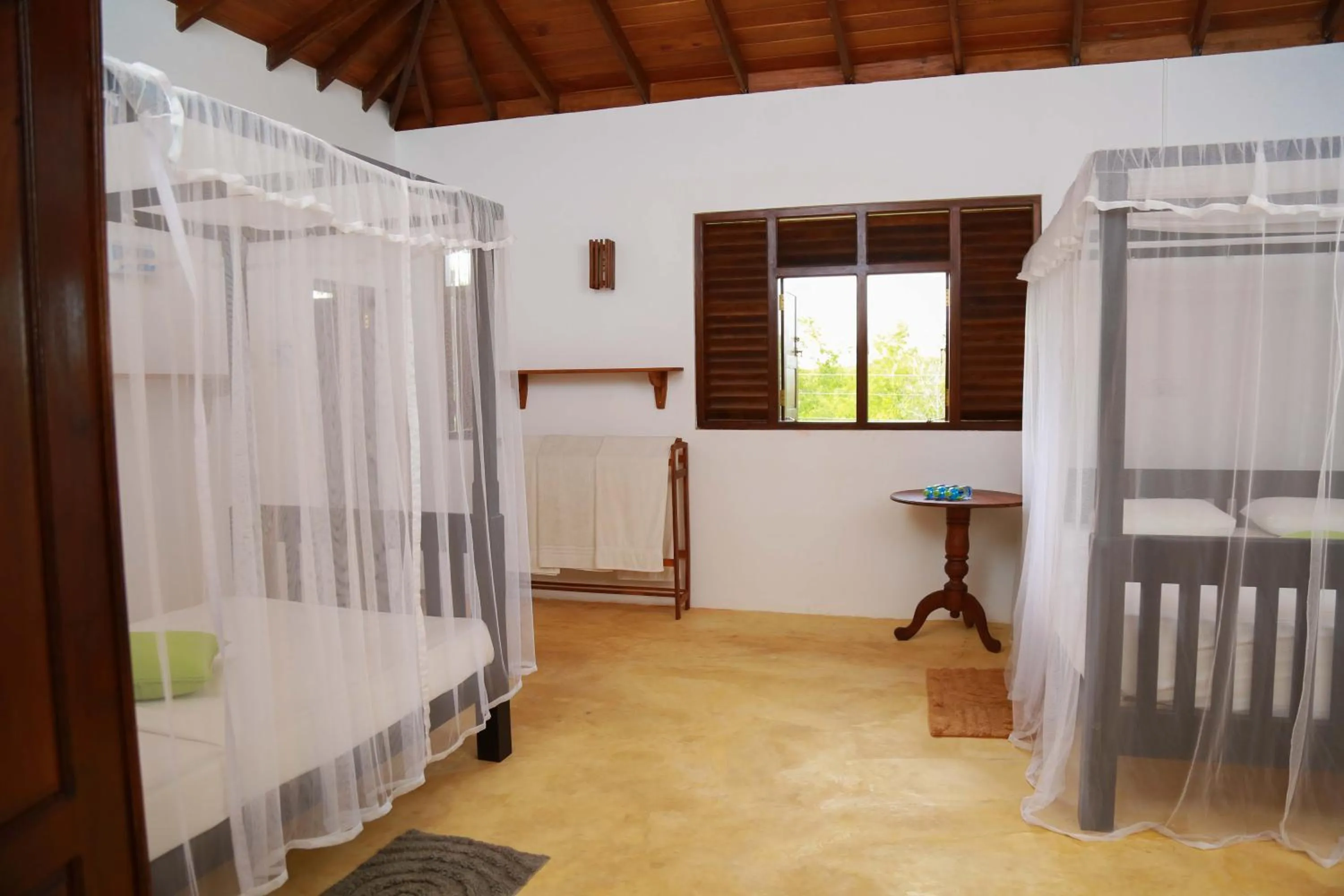 Bed in Ganesh Garden Beach Cabanas