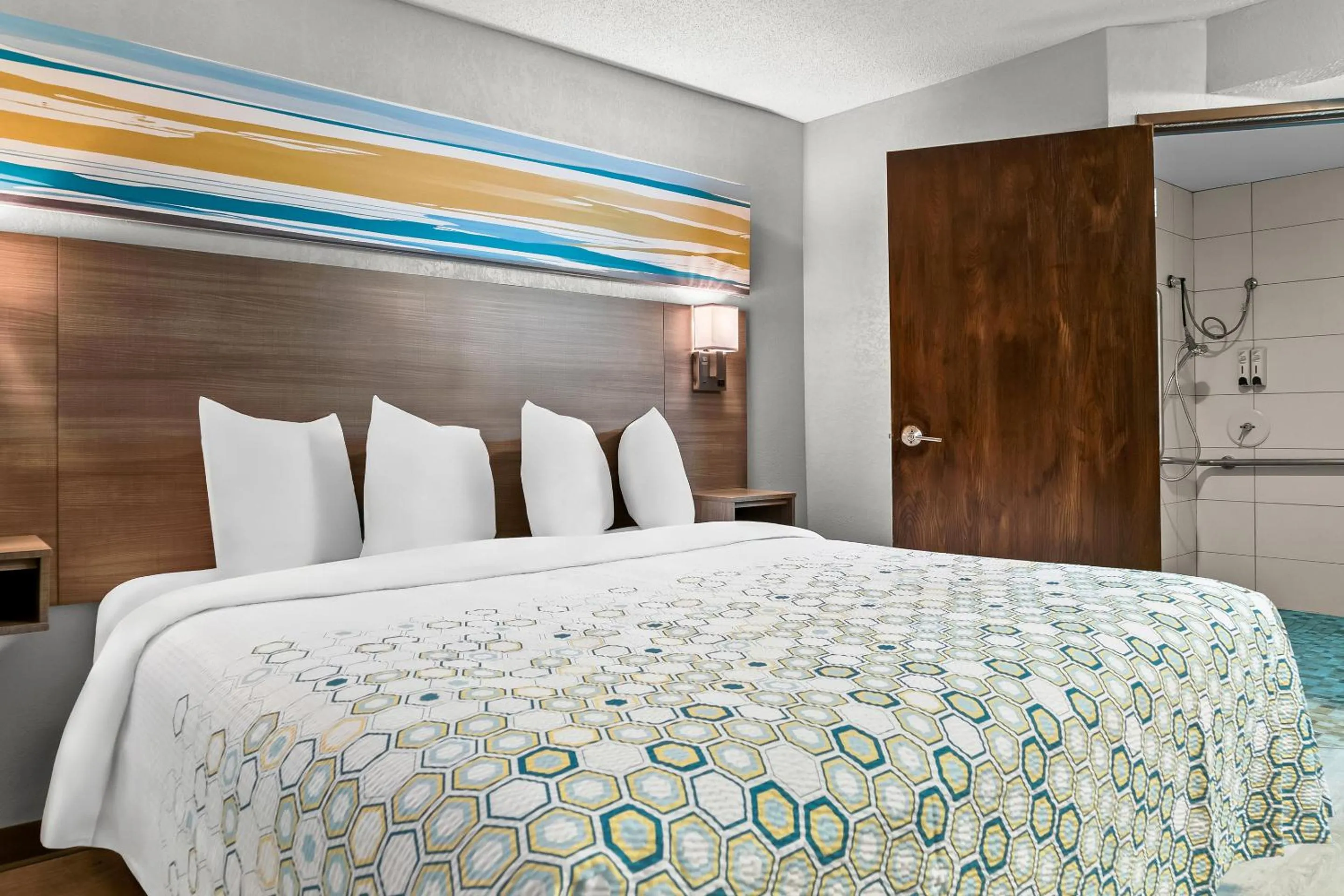 Photo of the whole room, Bed in HomeTowne Studios by Red Roof Flint