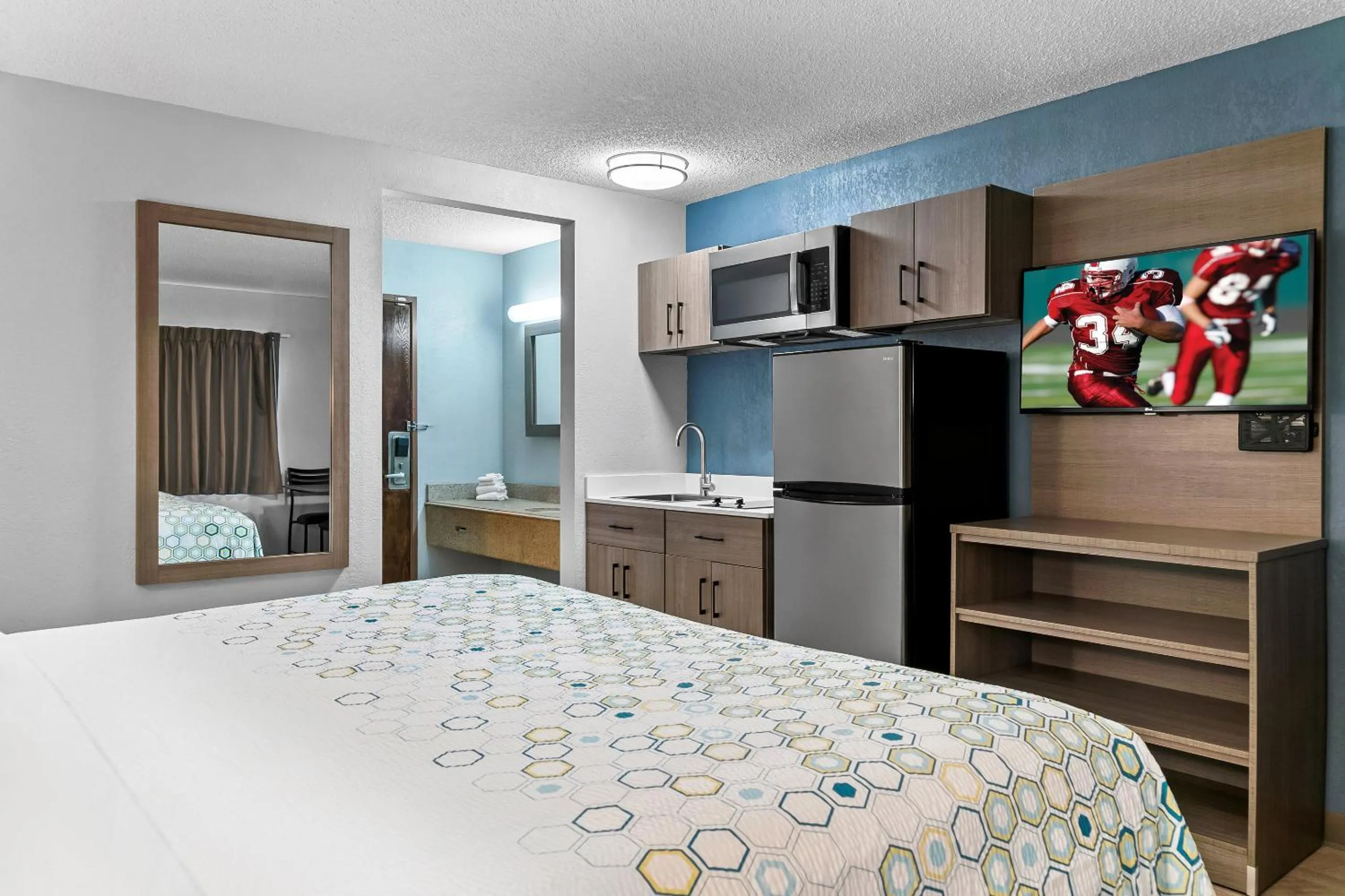 Photo of the whole room, Bed in HomeTowne Studios by Red Roof Flint