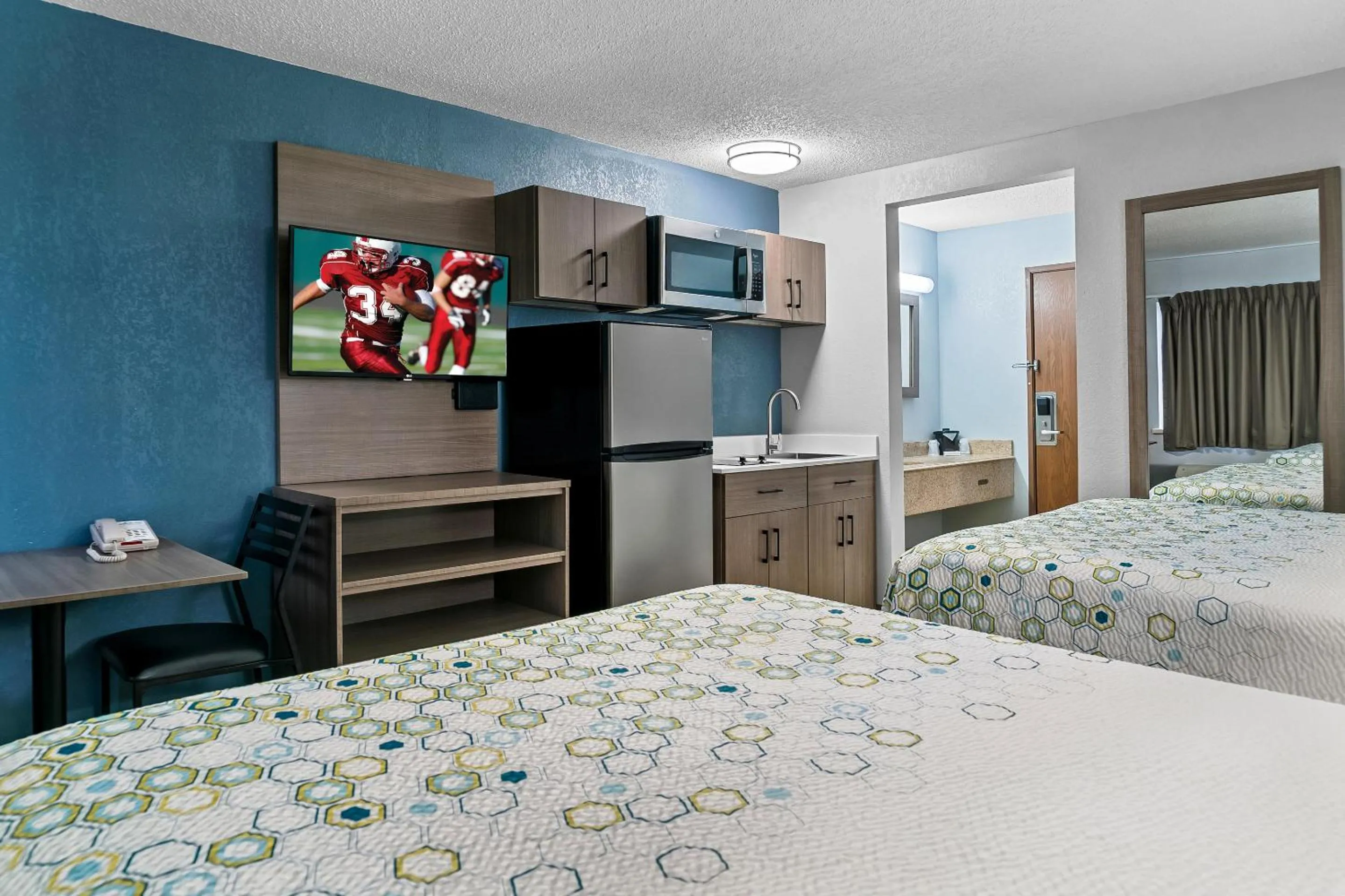 Photo of the whole room, Bed in HomeTowne Studios by Red Roof Flint