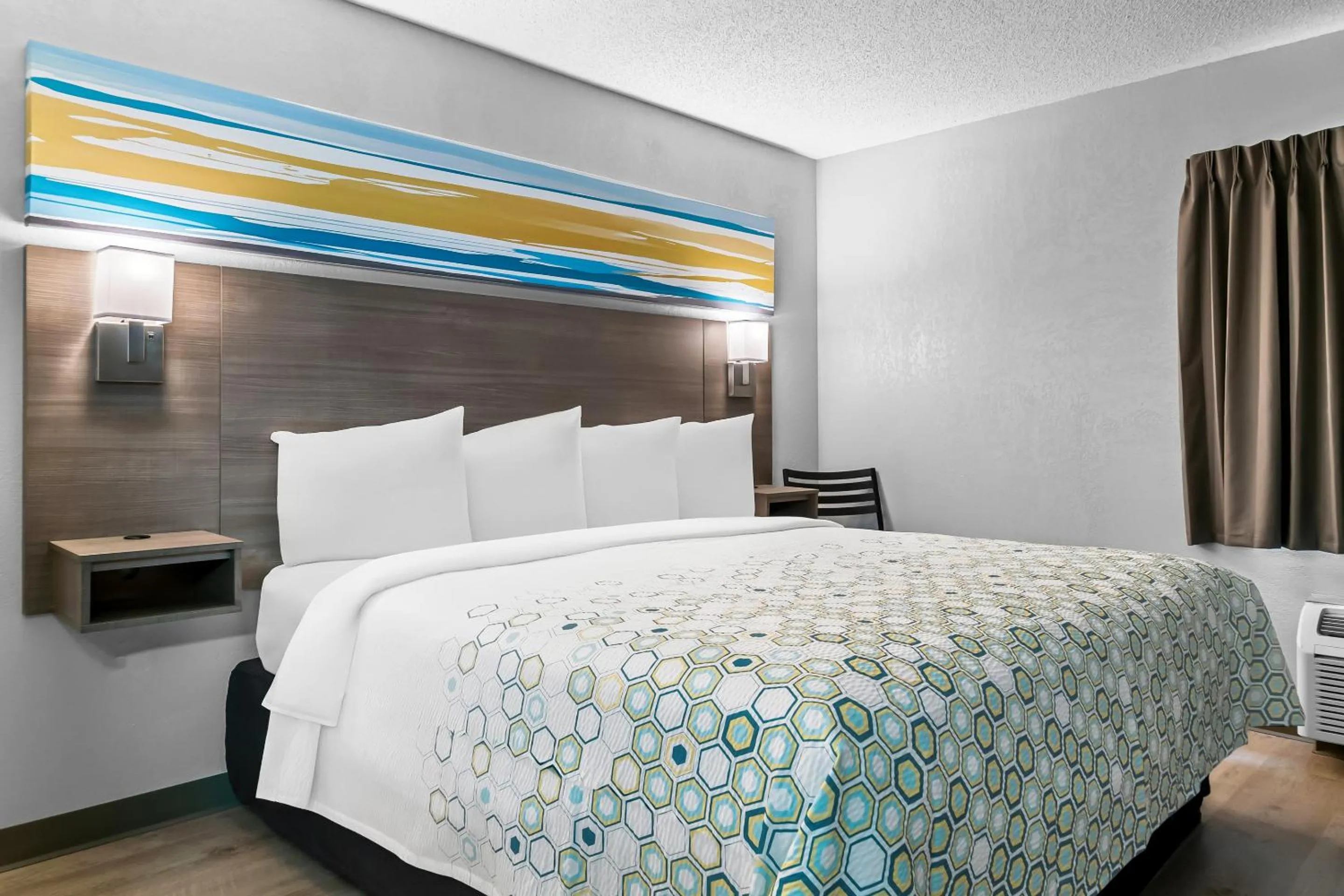 Photo of the whole room, Bed in HomeTowne Studios by Red Roof Flint