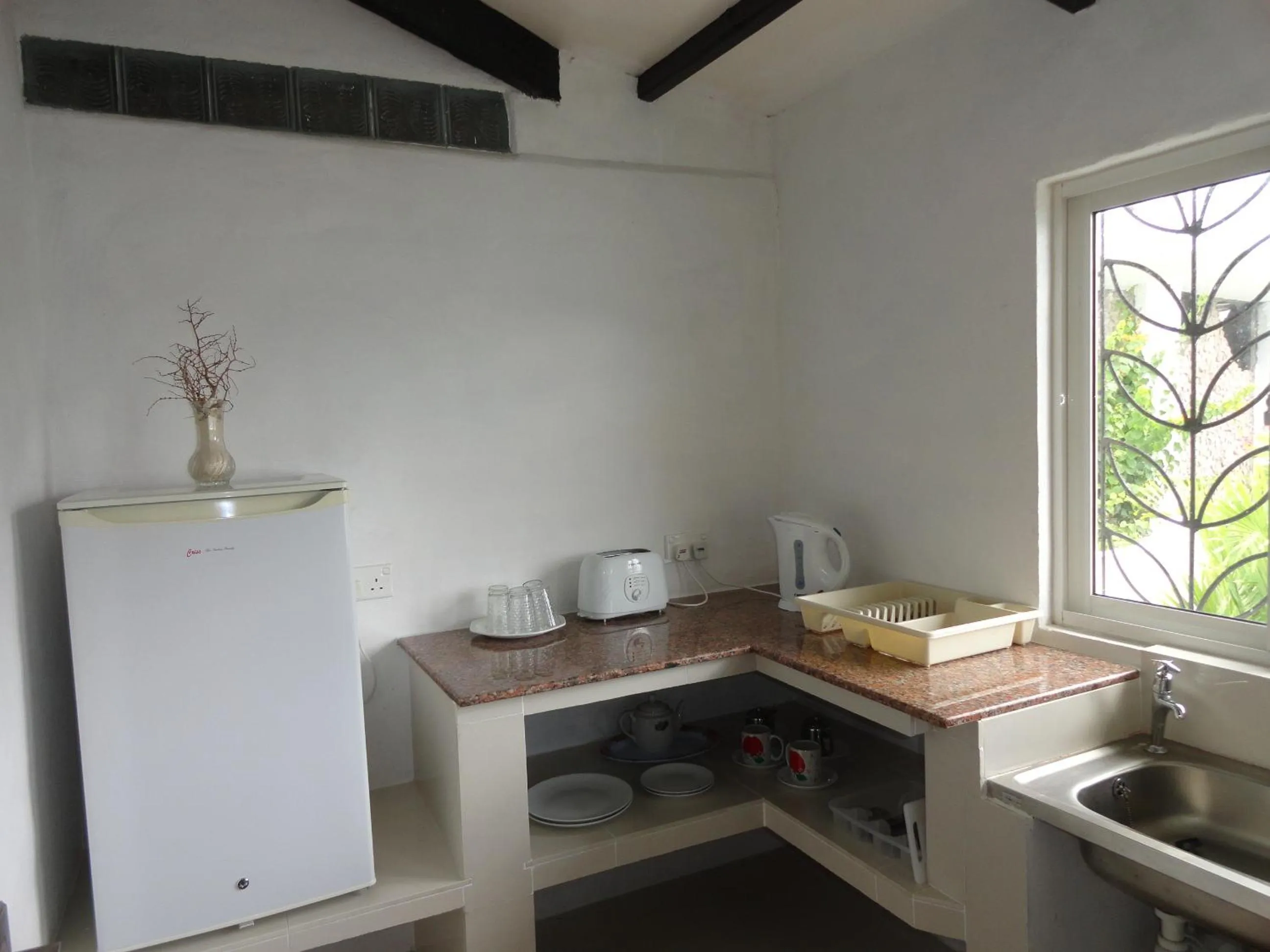 Kitchen or kitchenette in Lazare Picault Hotel