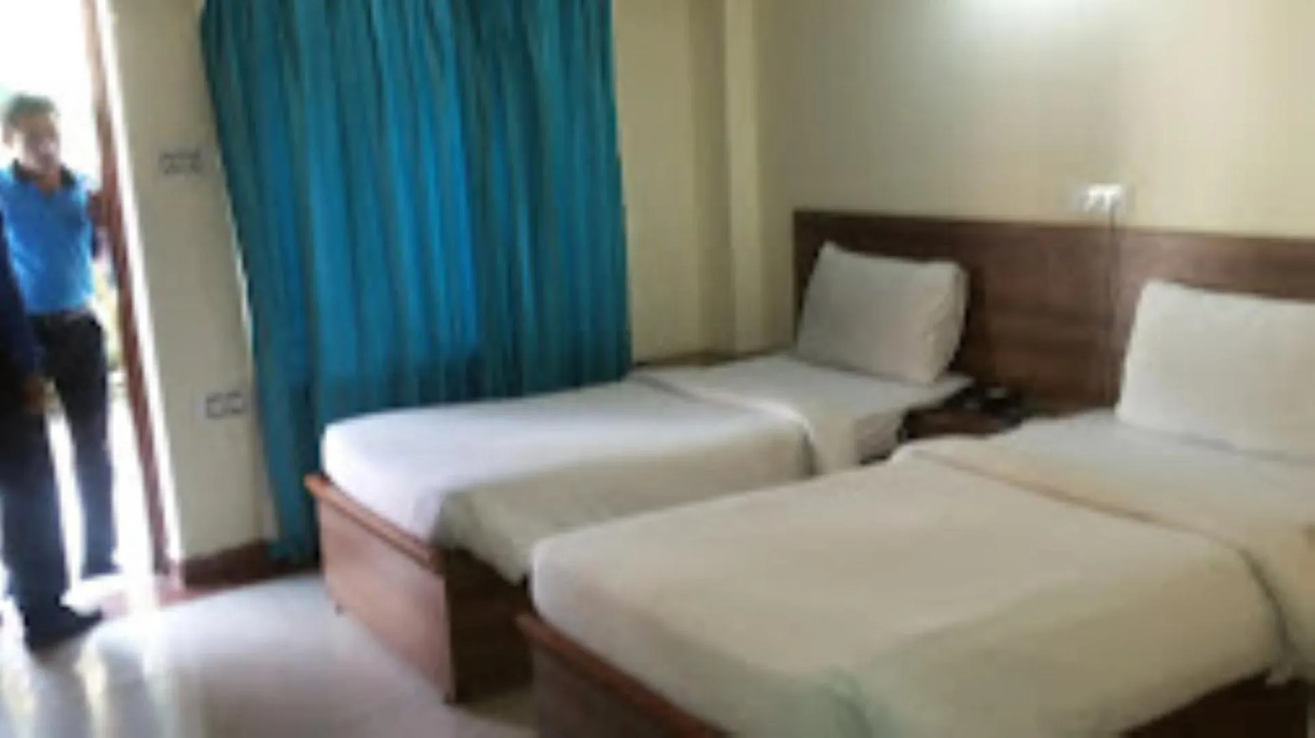 Bed in Blue Lily Beach Resort