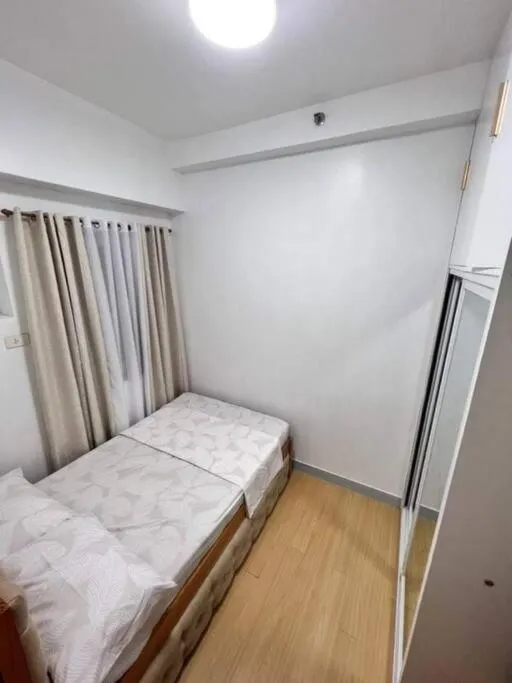 Bed in Happy Home Staycation