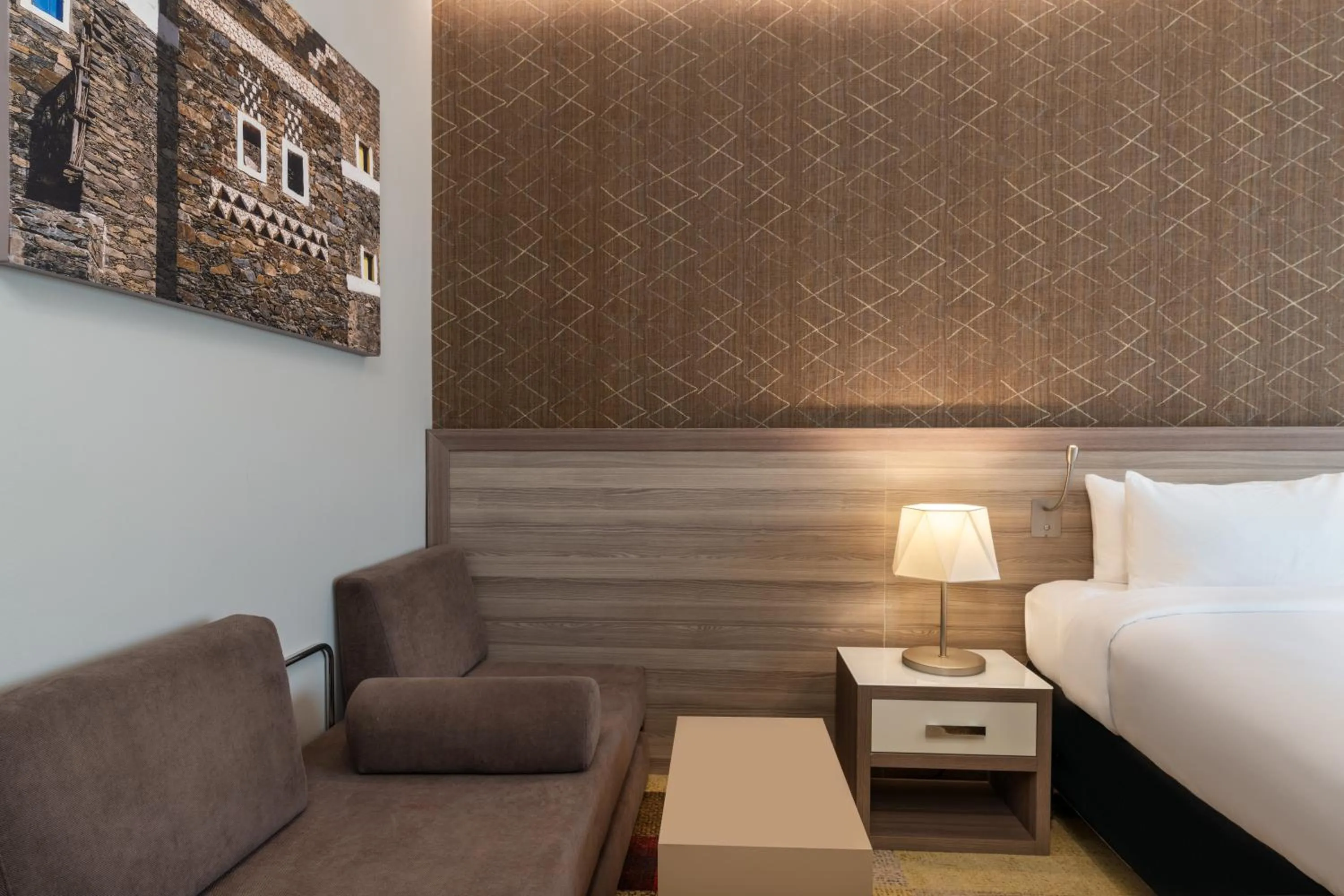 Seating area, Bed in Mercure Makkah Aziziah