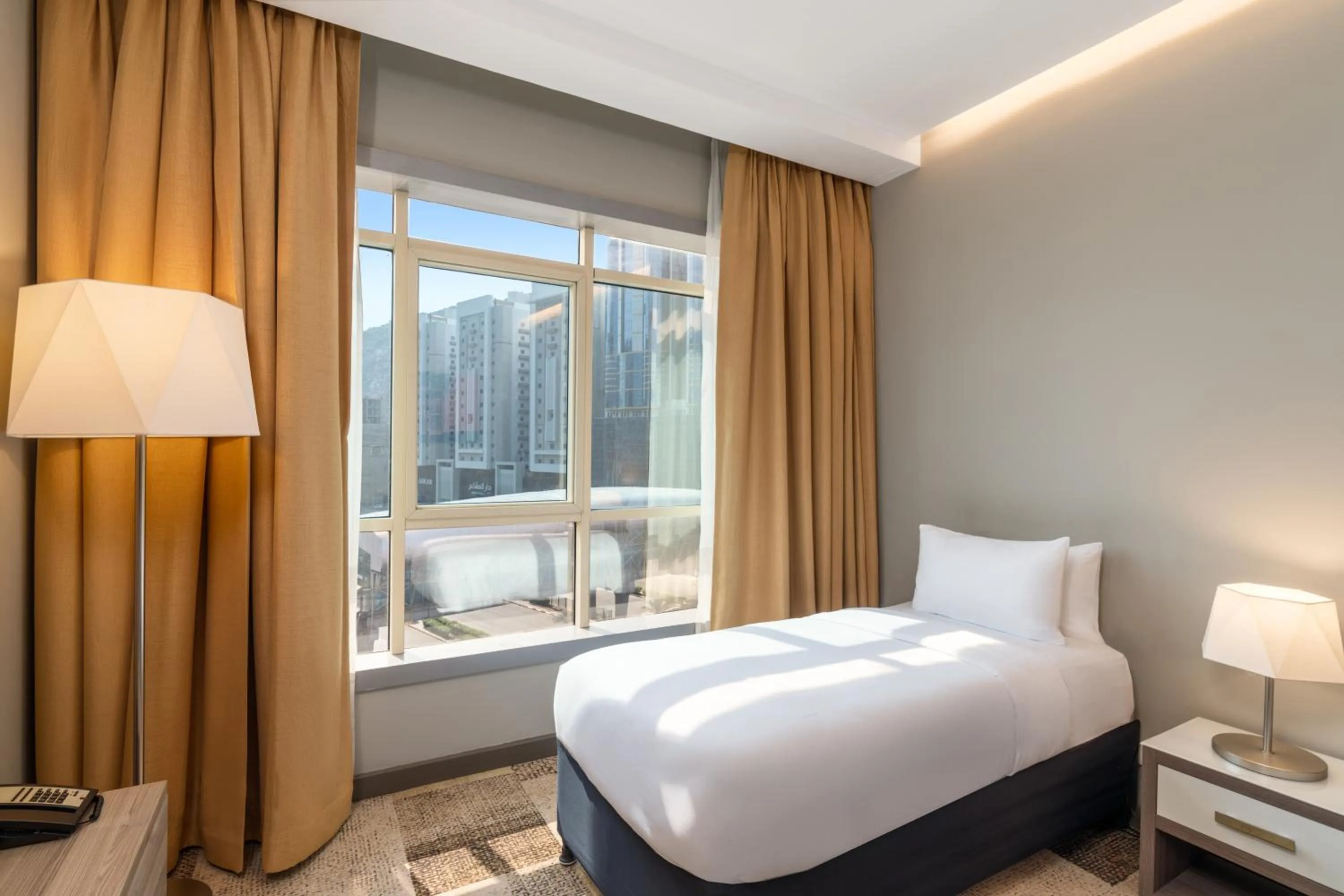 Bed in Mercure Makkah Aziziah