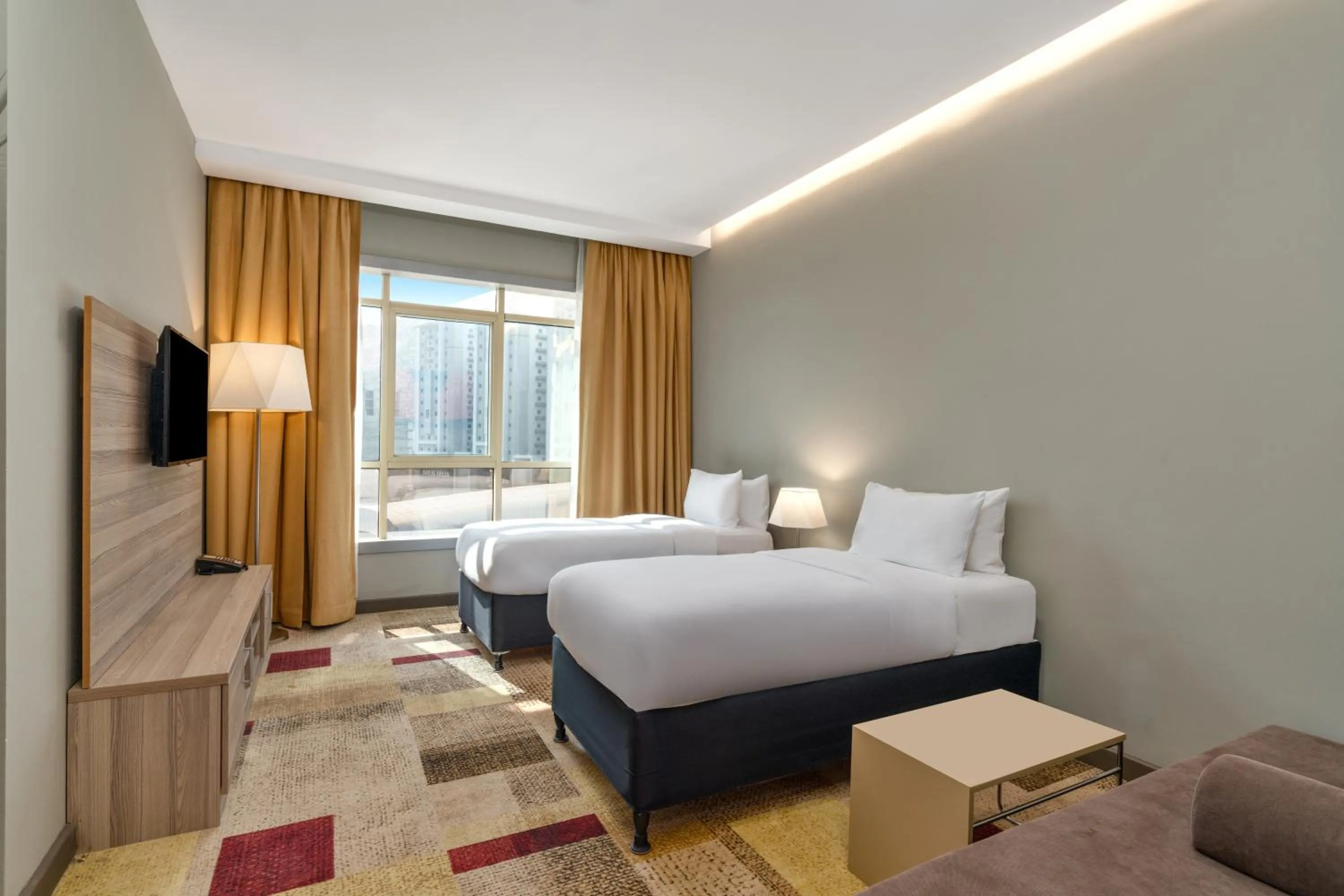 Bed in Mercure Makkah Aziziah