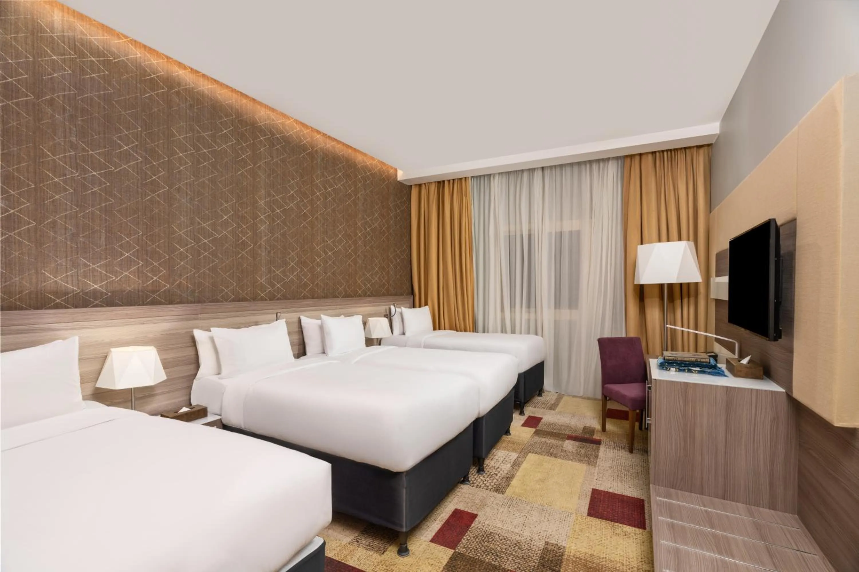 Bed in Mercure Makkah Aziziah