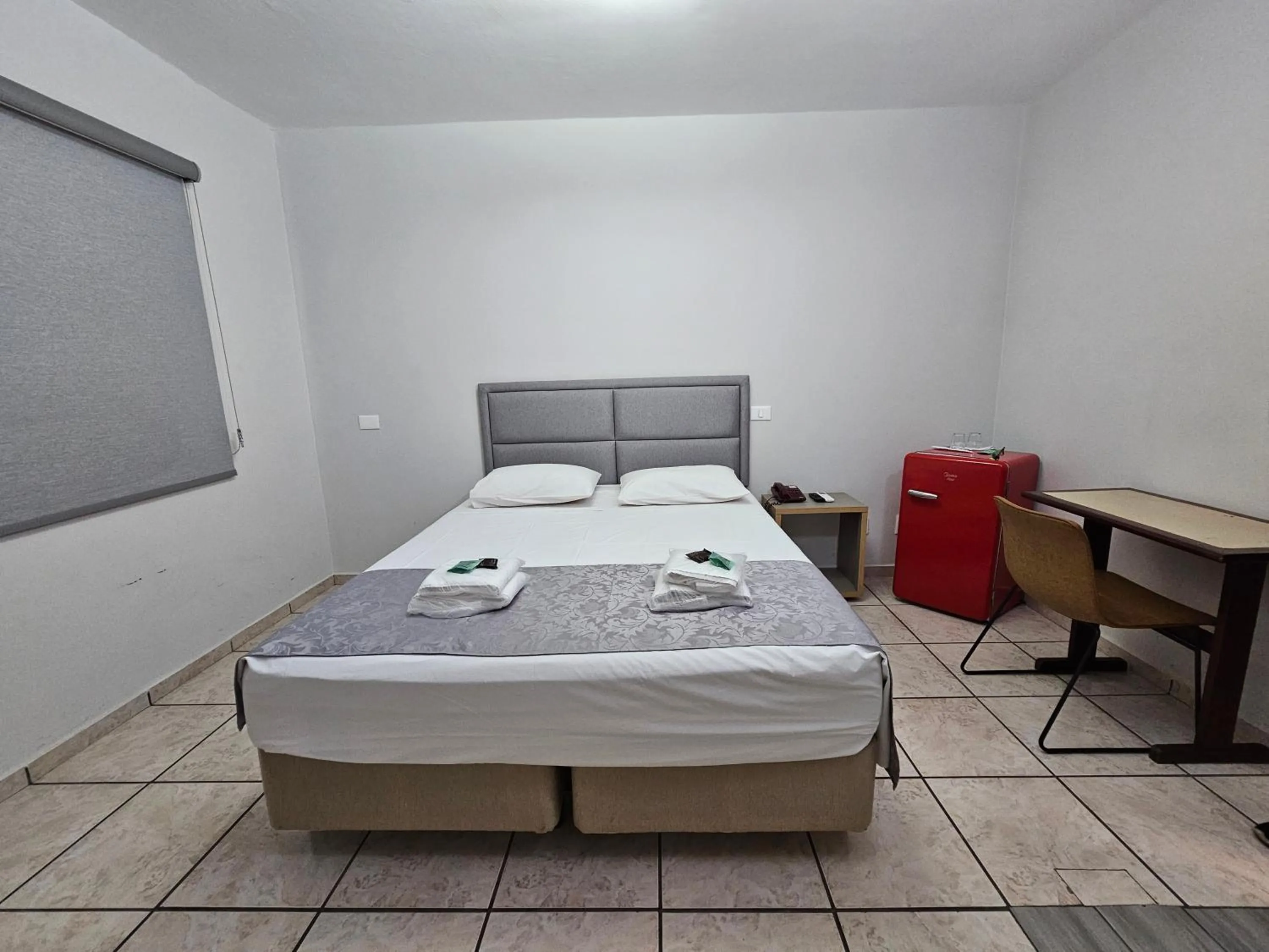 Bed in Optimum Plaza Hotel