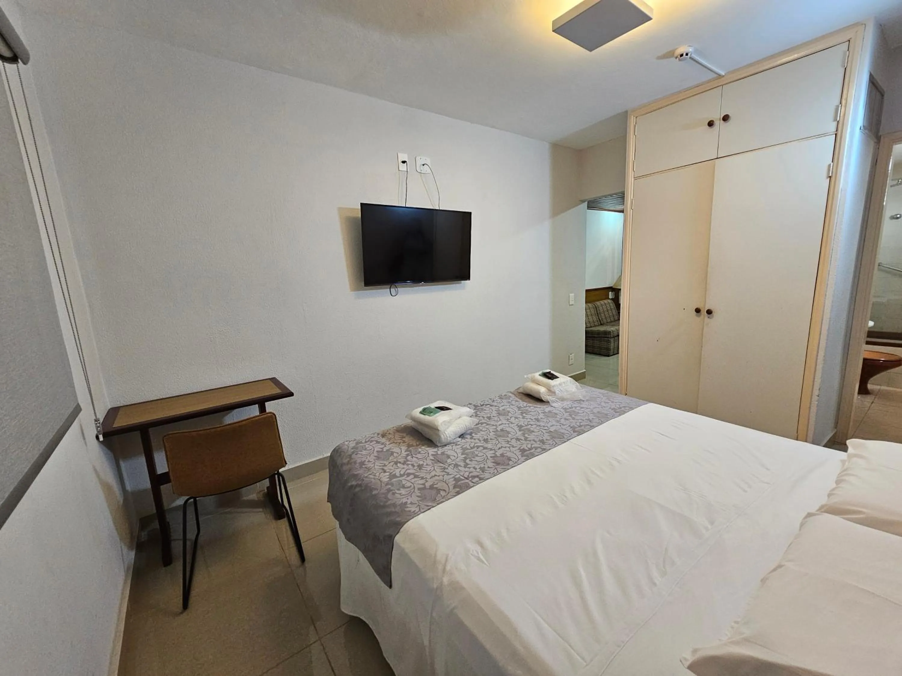 Bed in Optimum Plaza Hotel