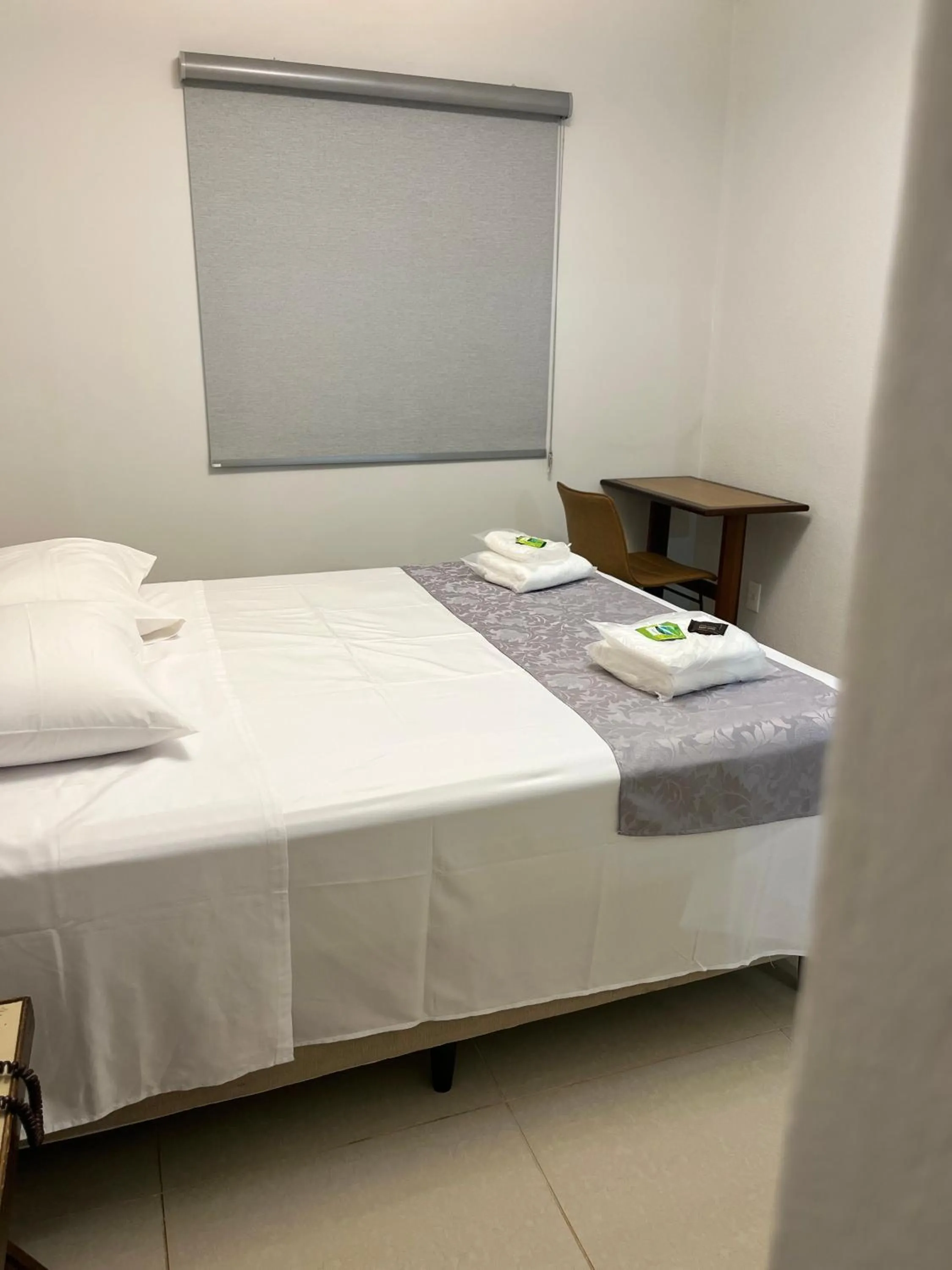 Bed in Optimum Plaza Hotel