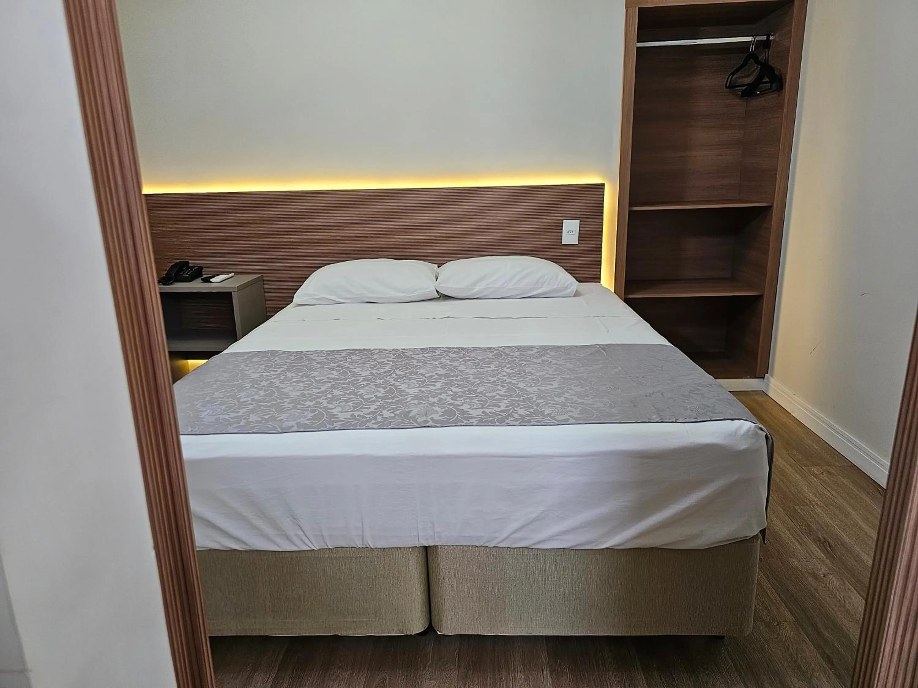 Bed in Optimum Plaza Hotel