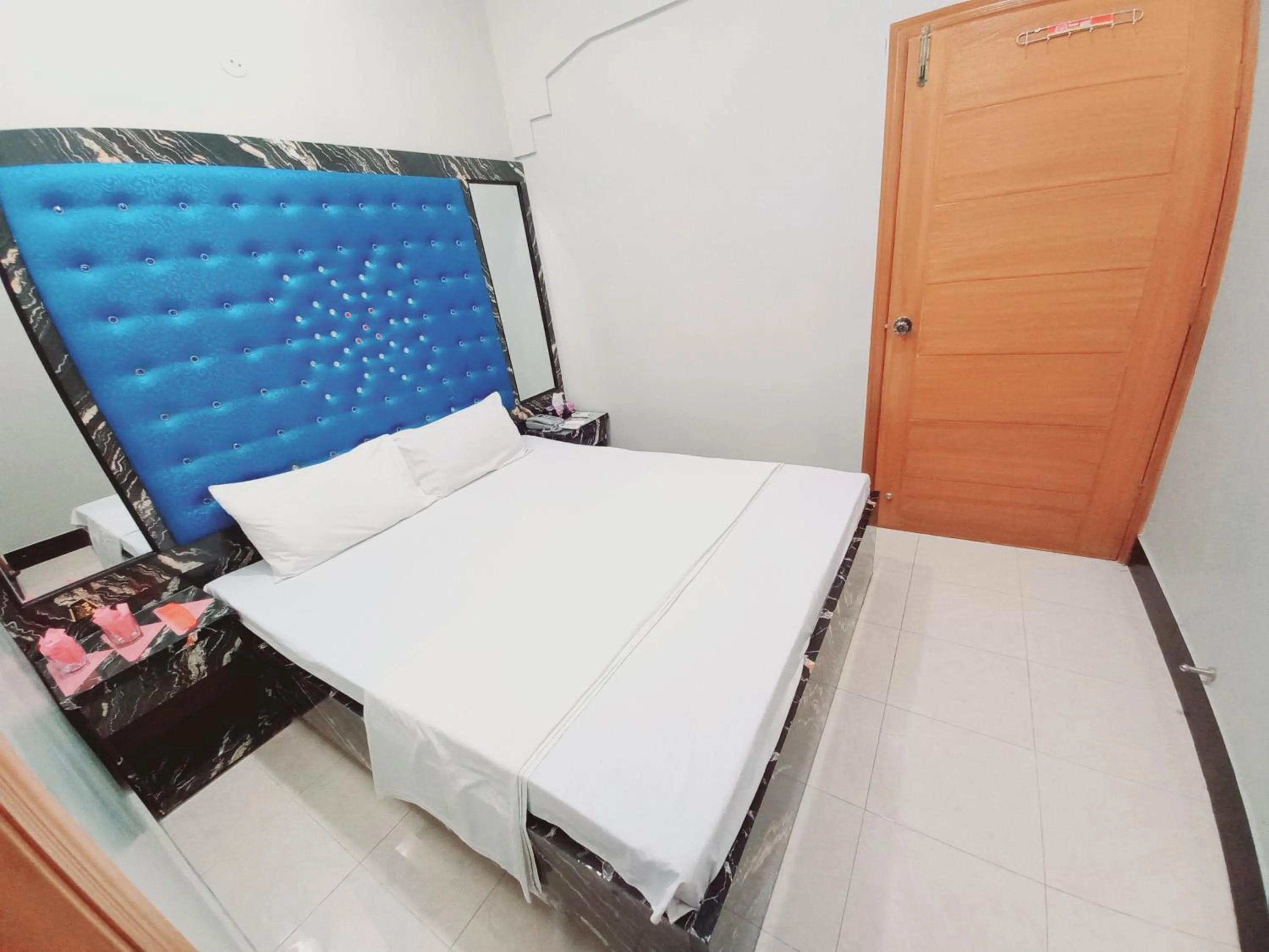 Bed in Rose Palace Guest House