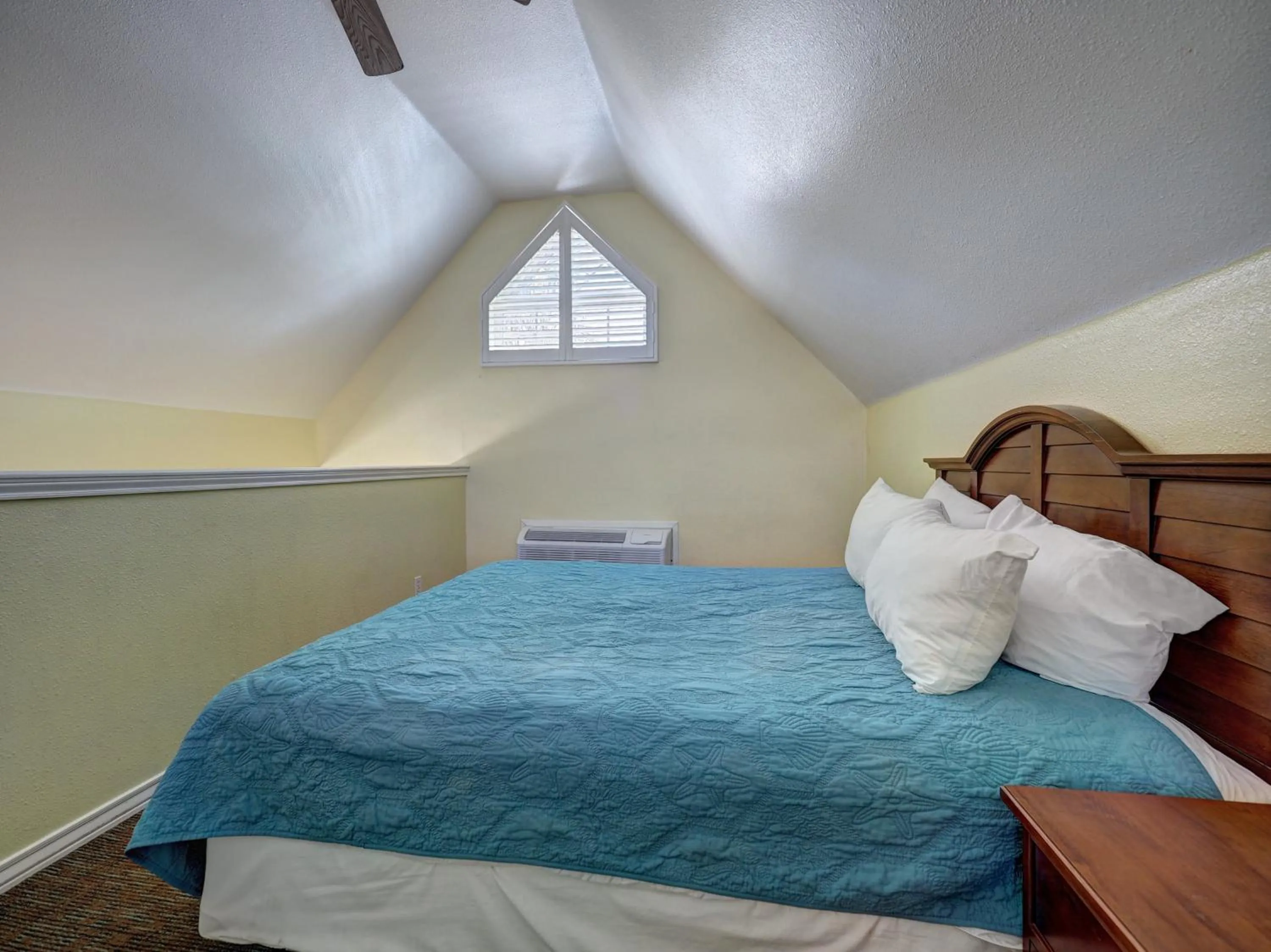 Bed in Seashell Village Resort near the beach with kitchens