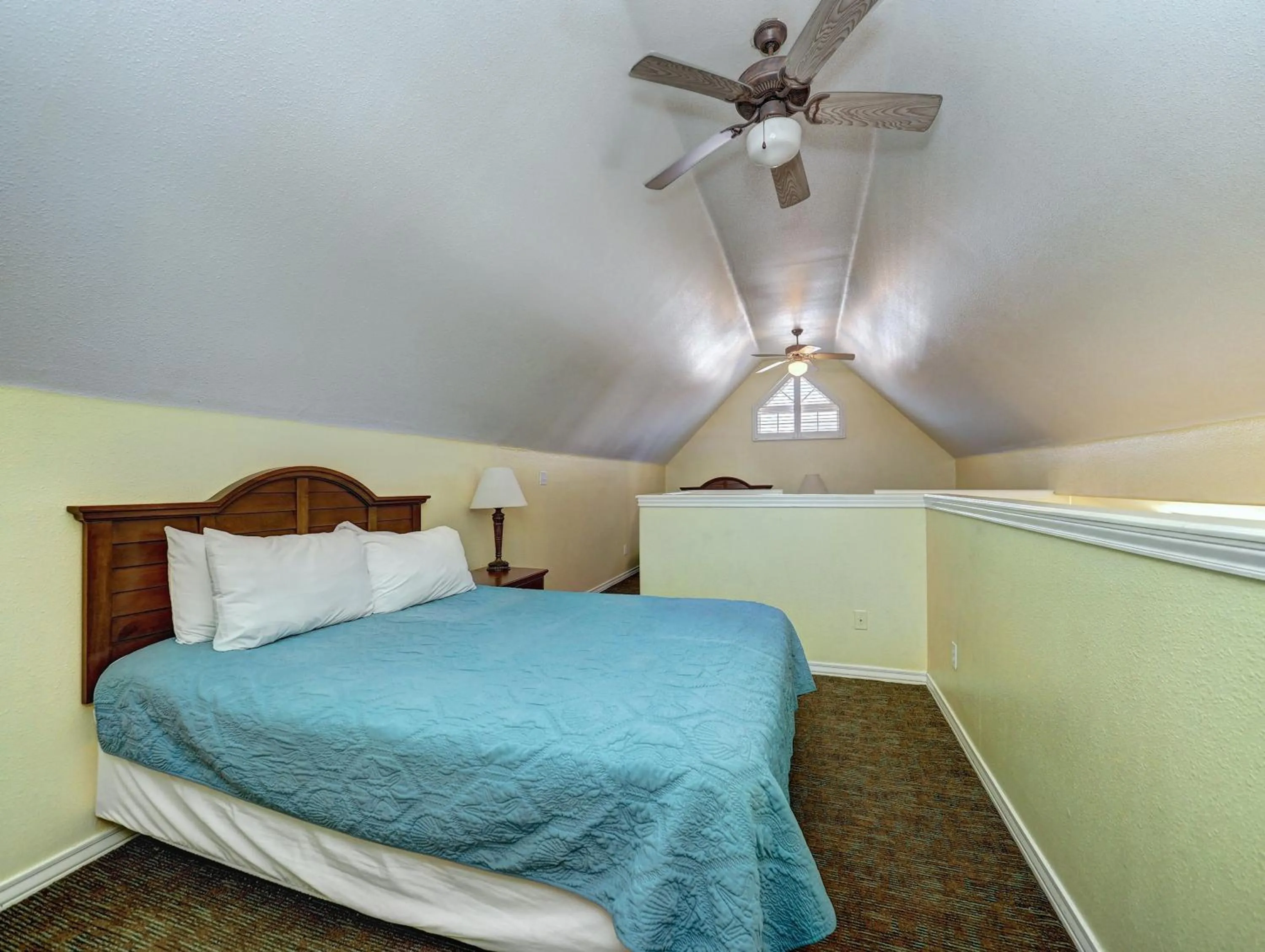 Bed in Seashell Village Resort near the beach with kitchens