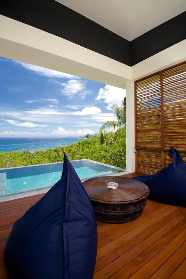 Communal lounge/ TV room in Overthemoon Luxury Pool Villas