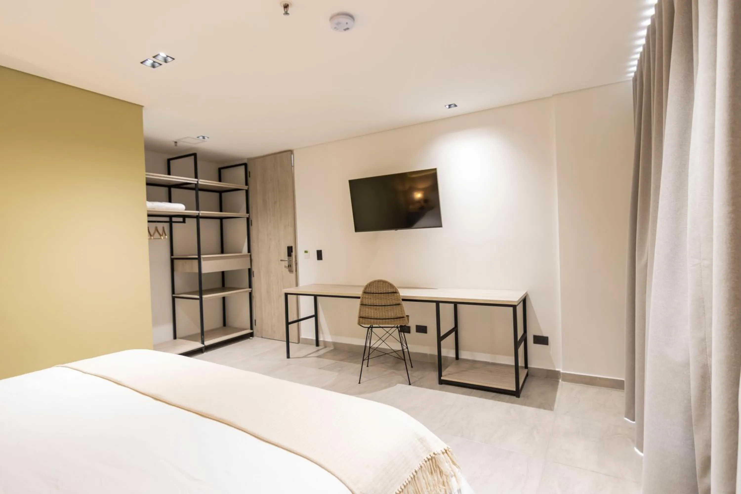 Bed in Sonata 44 Hotel Laureles