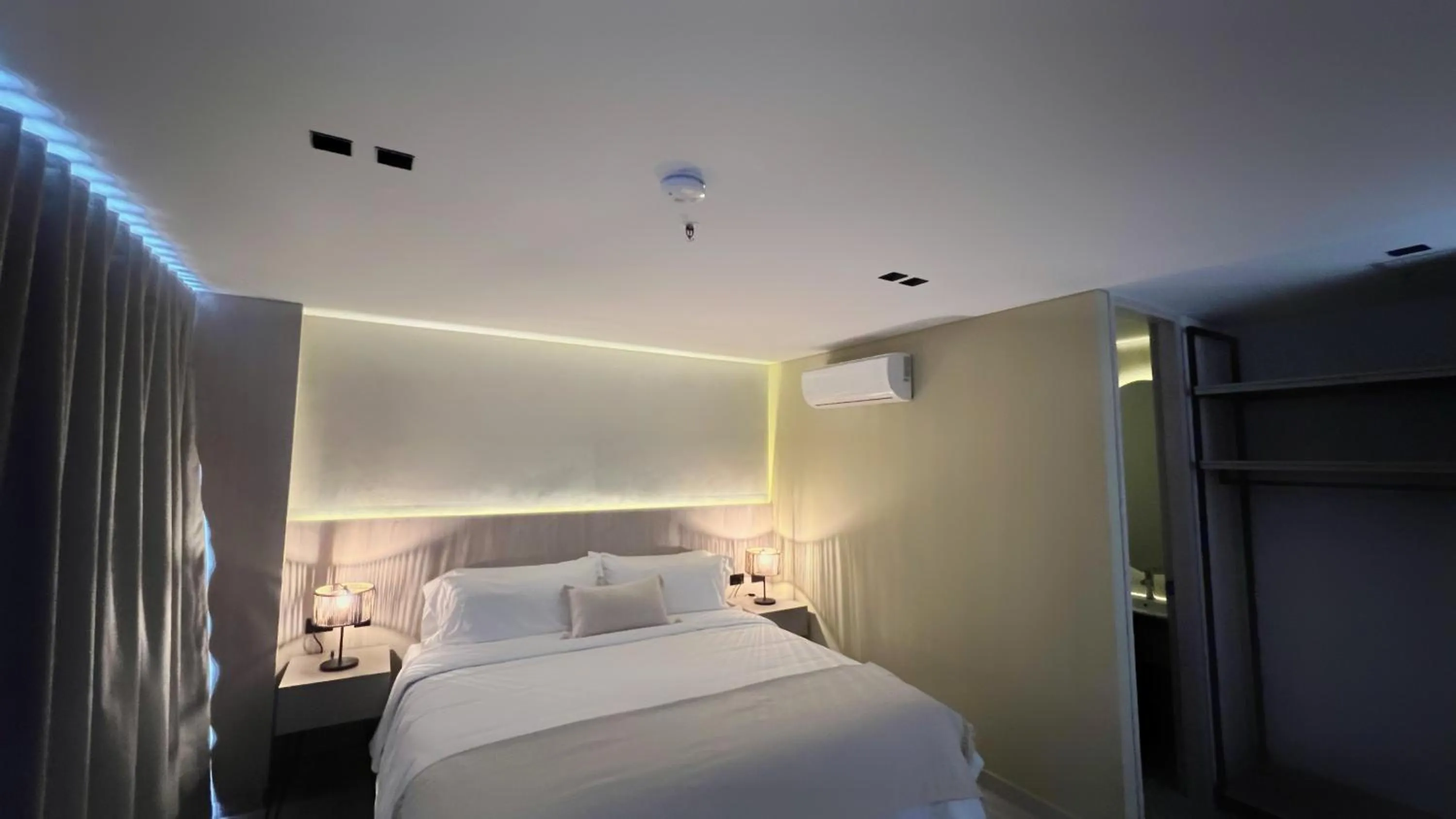 Bed in Sonata 44 Hotel Laureles