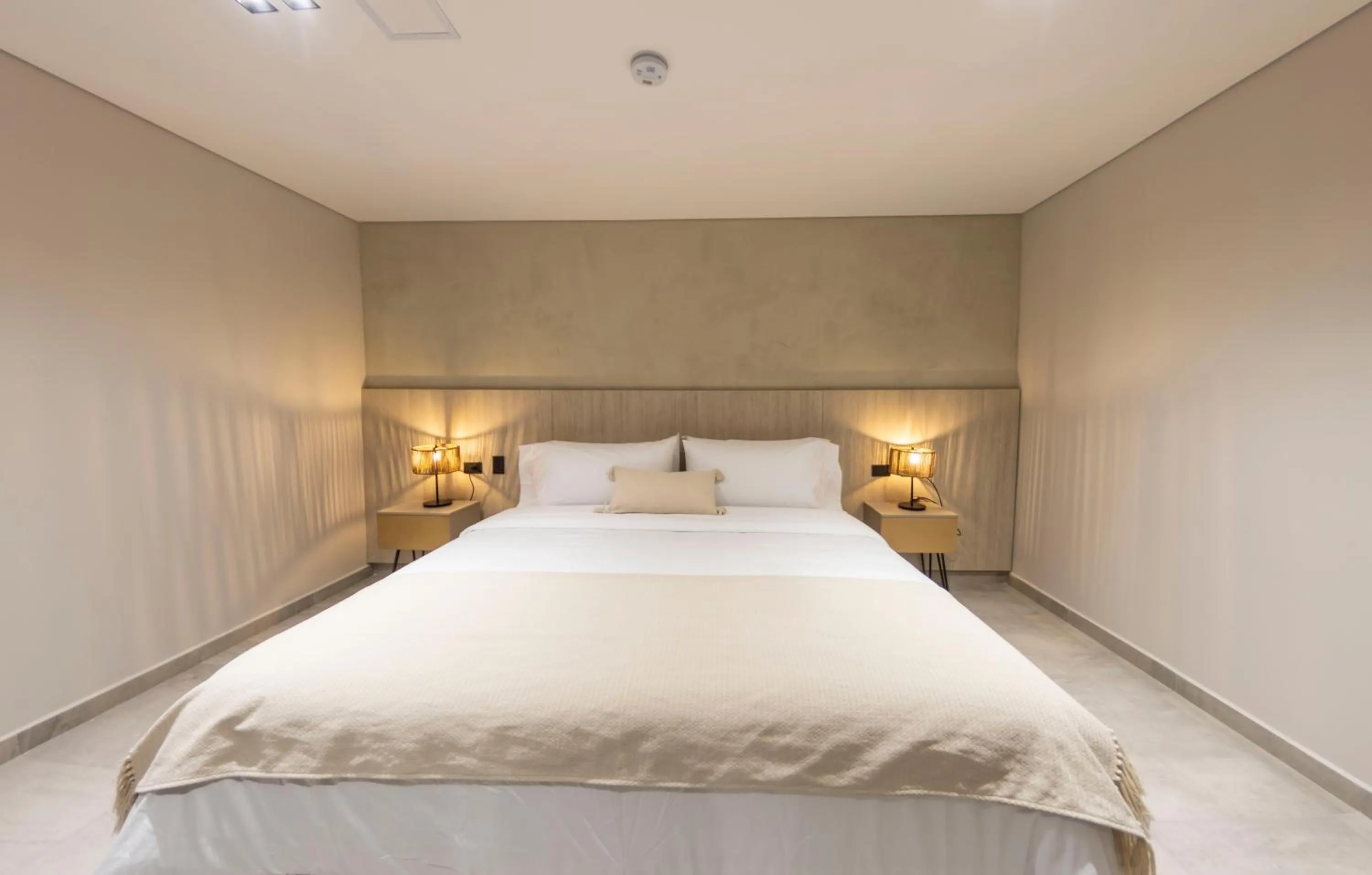 Bed in Sonata 44 Hotel Laureles