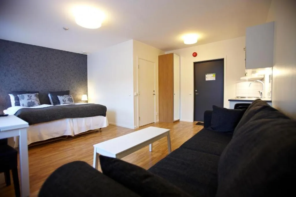 Living room, Bed in Riverside stay at Hotel - Ängelholm