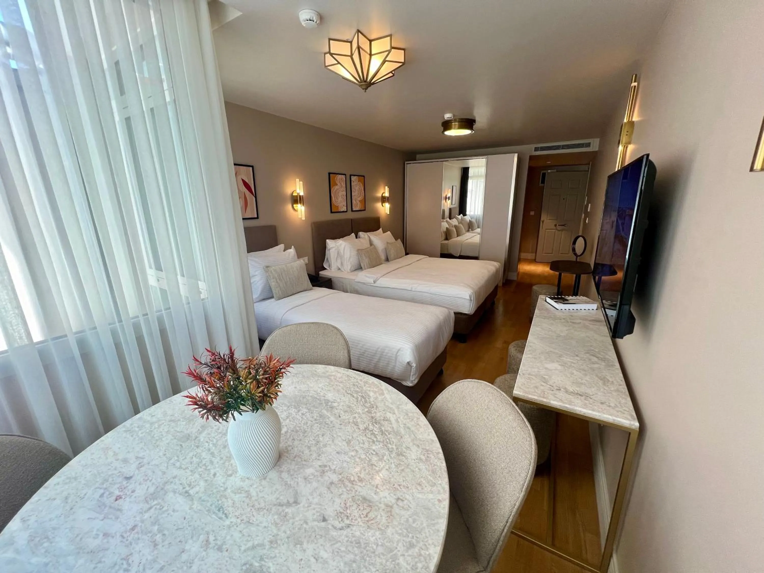 Bed in Weingart Suites Hotel