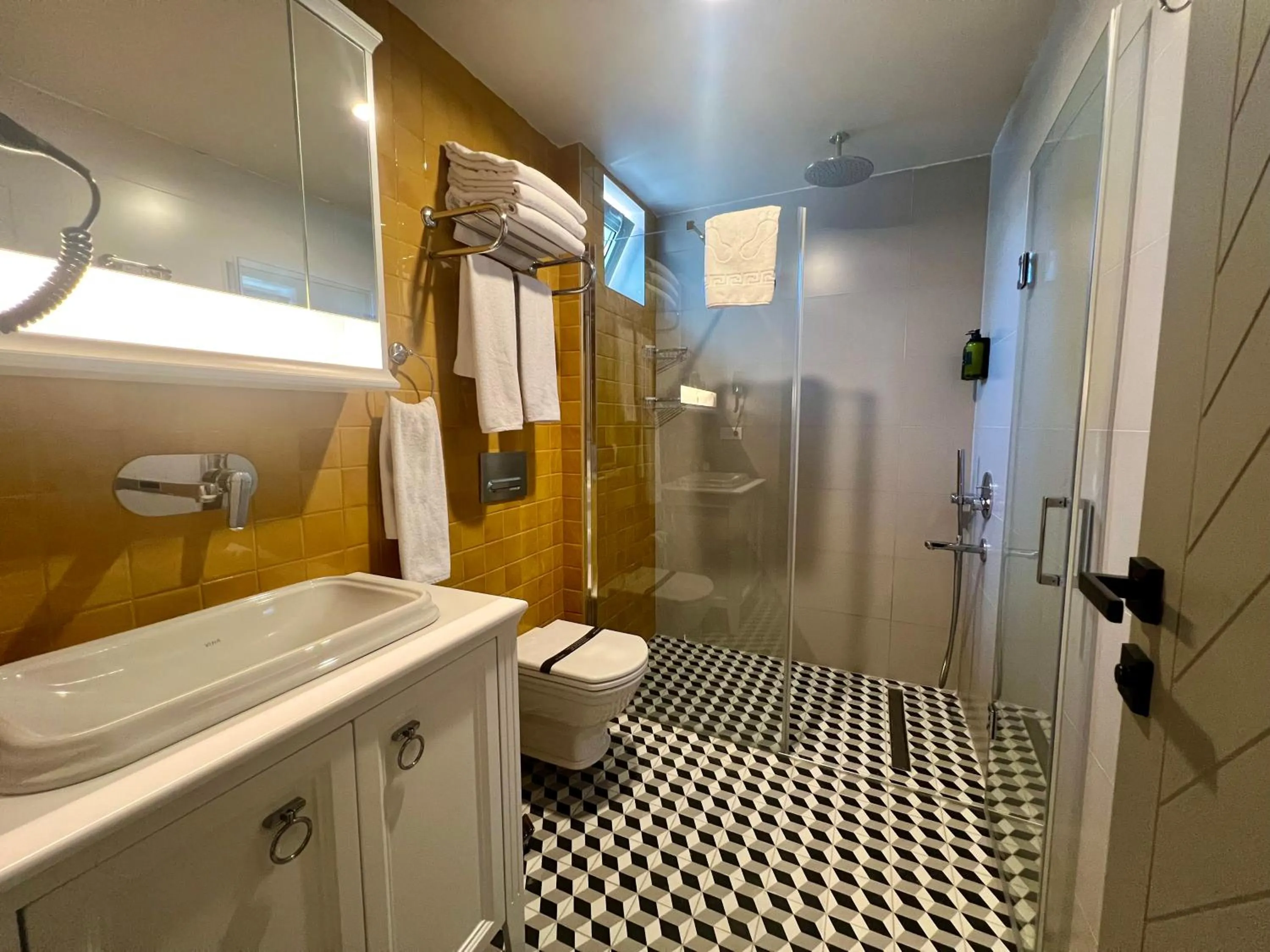 Toilet in Weingart Suites Hotel