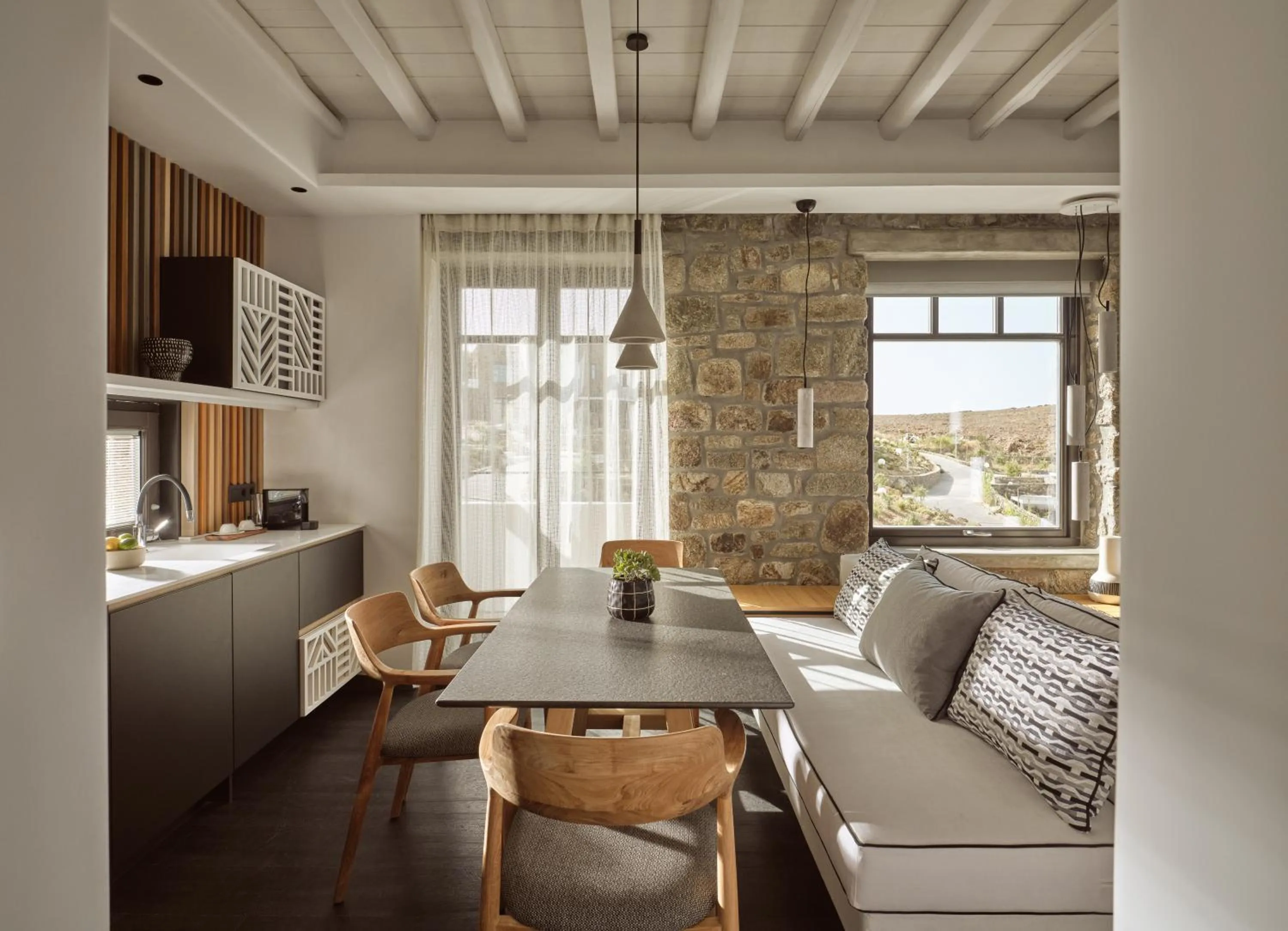 Seating area in Semeli Coast Mykonos Curio Collection by Hilton