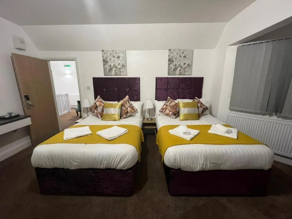 Bedroom in OYO 4 Sisters Inn