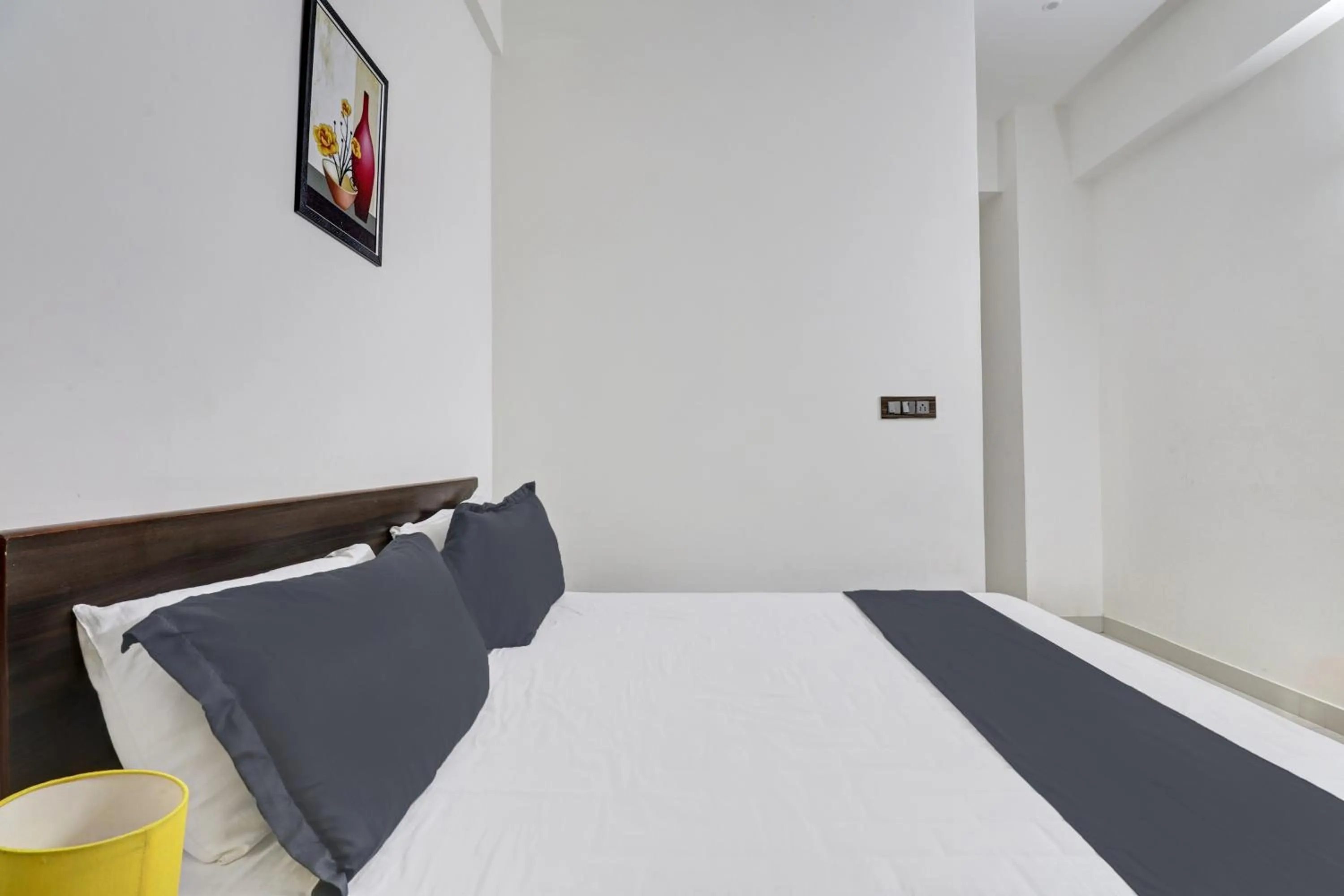 Bedroom in Hotel O J.K. Suites & Rooms