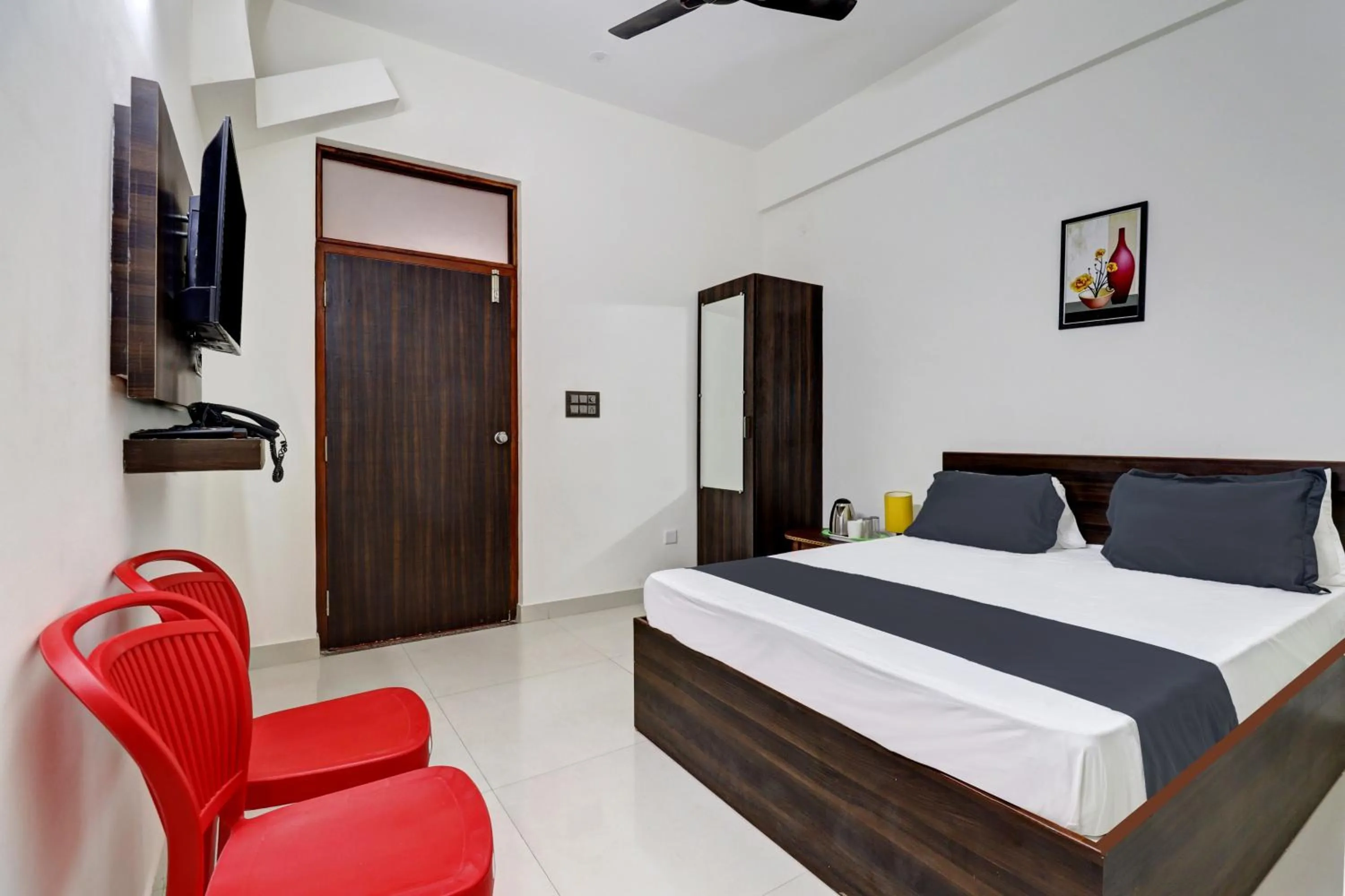 Bedroom in Hotel O J.K. Suites & Rooms