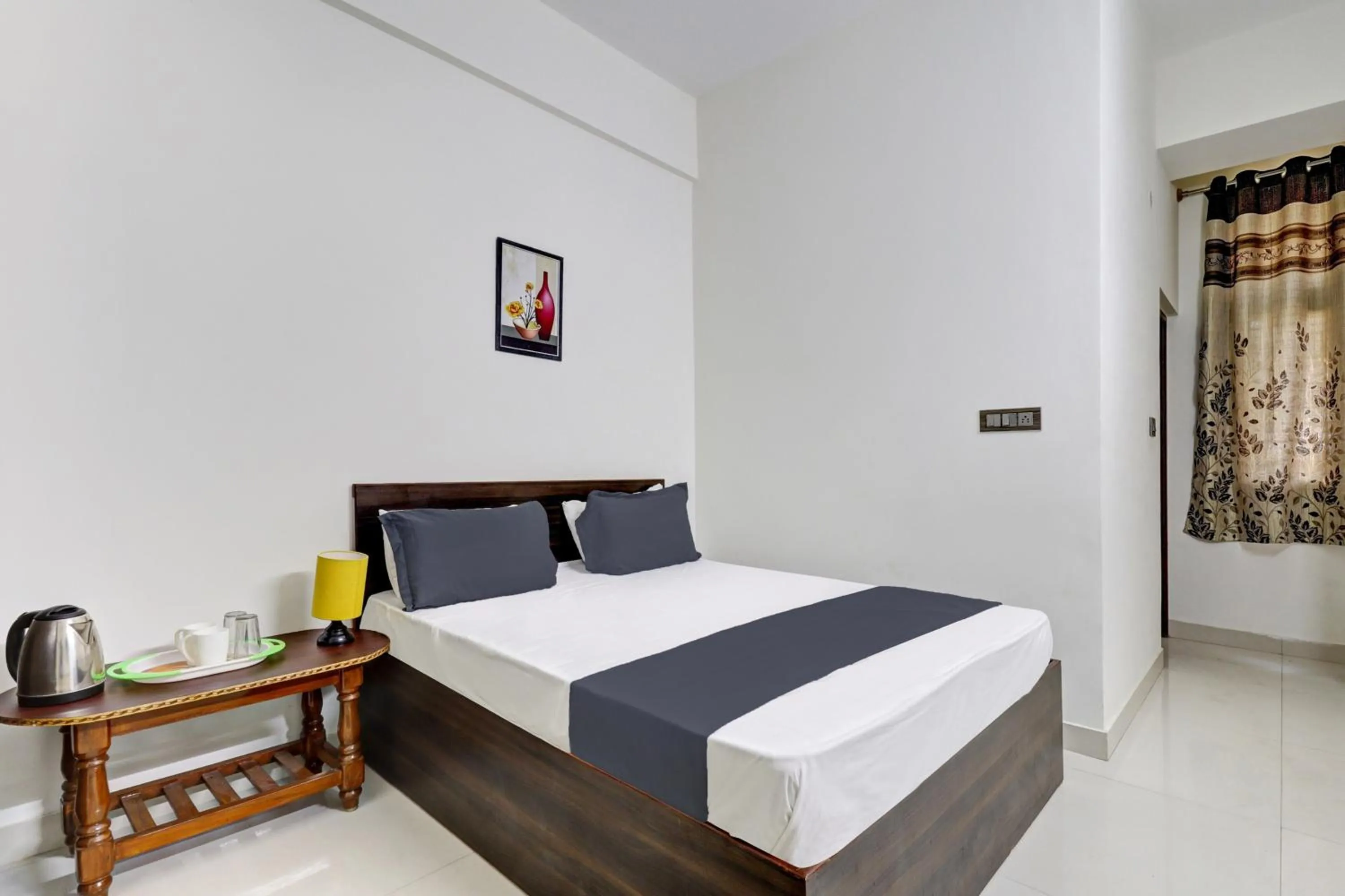 Bedroom in Hotel O J.K. Suites & Rooms