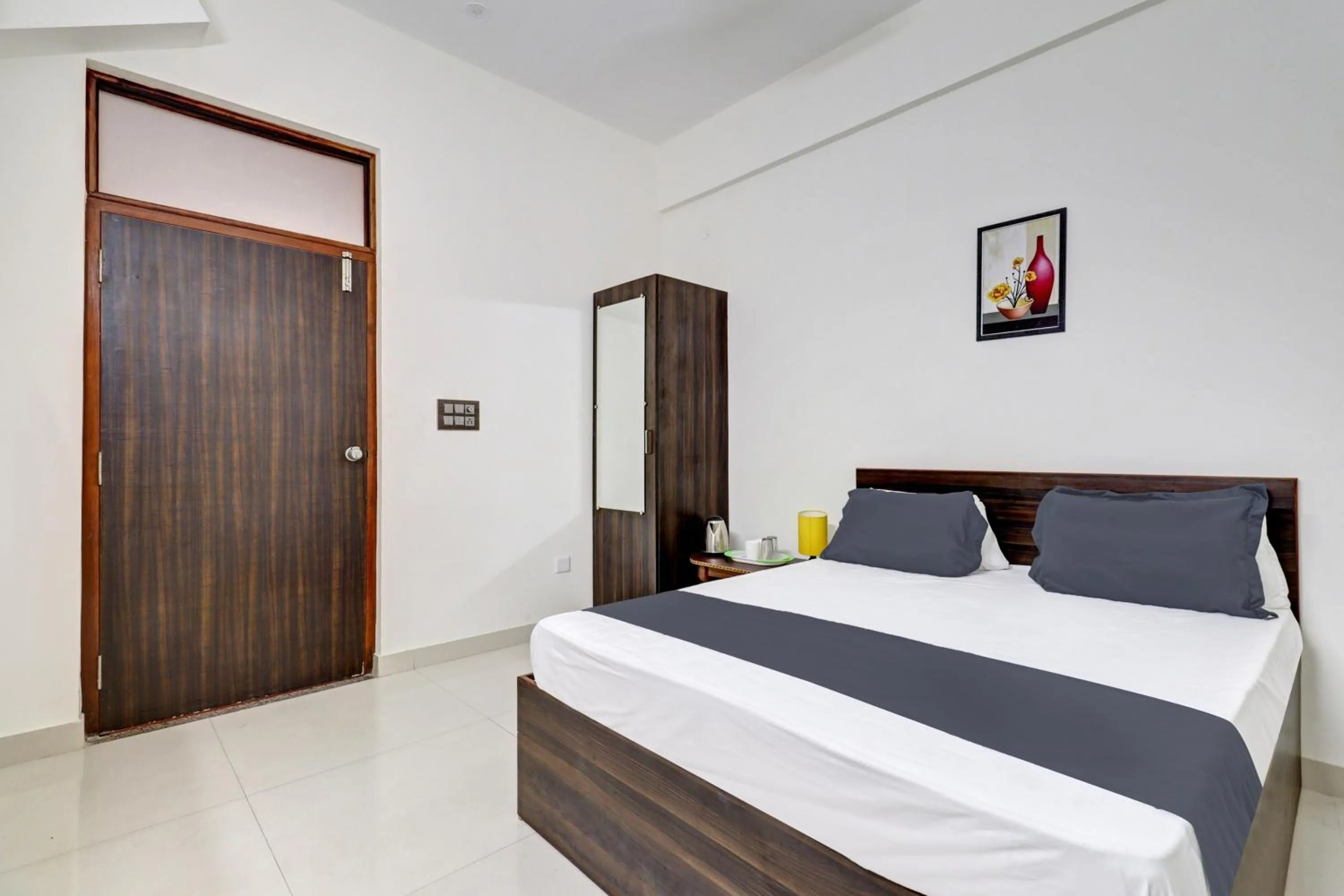 Bedroom in Hotel O J.K. Suites & Rooms