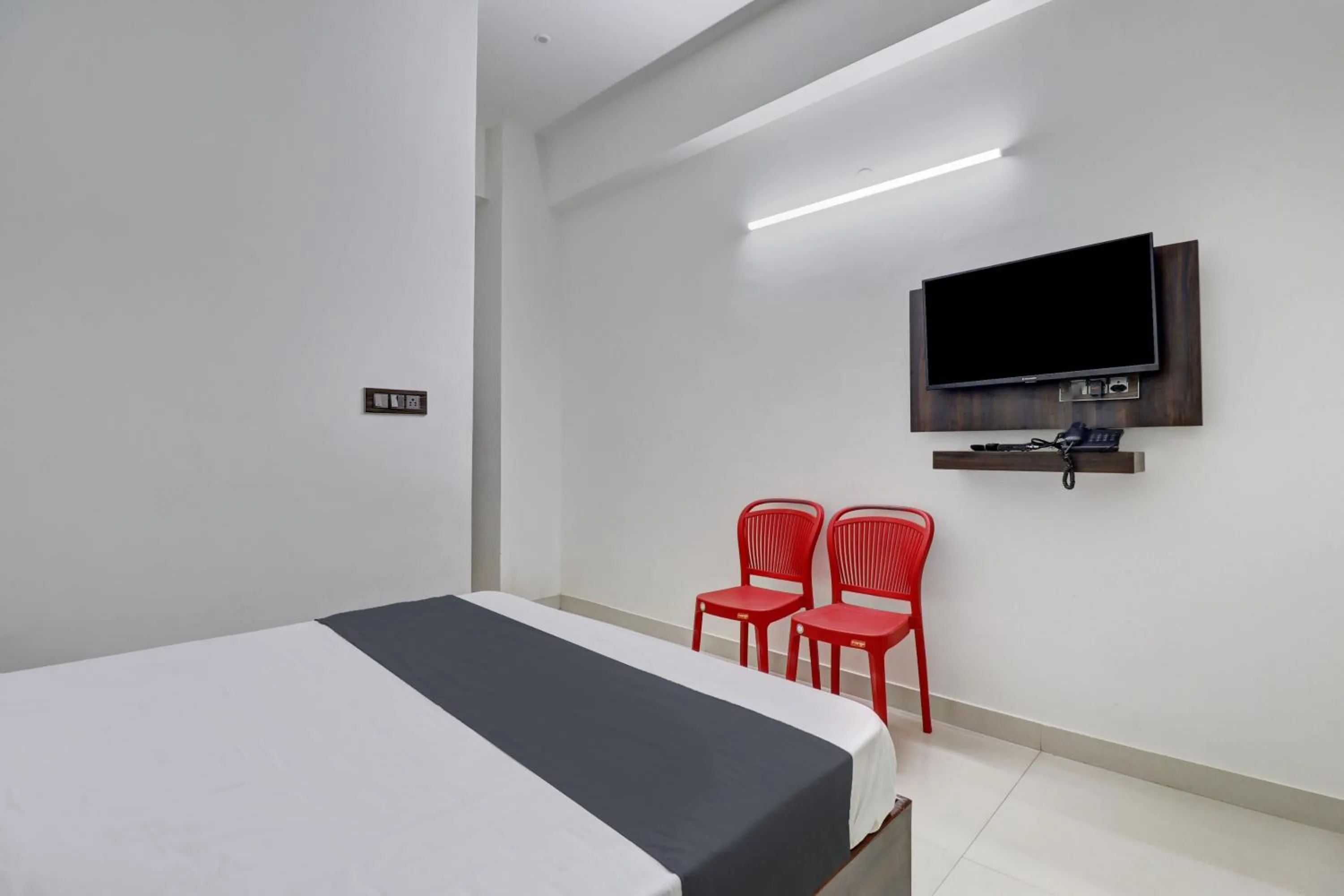 Bedroom in Hotel O J.K. Suites & Rooms