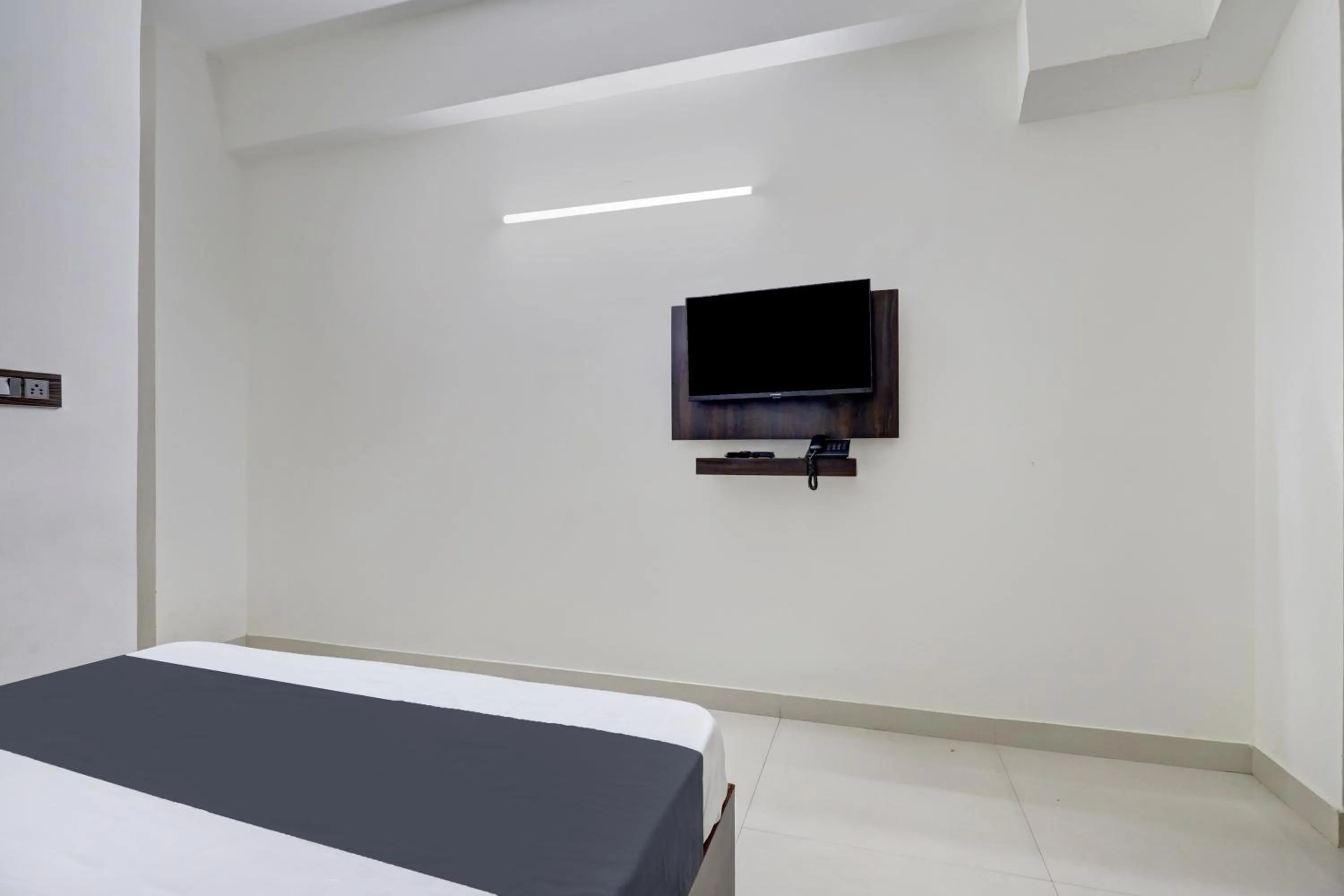 Bedroom in Hotel O J.K. Suites & Rooms