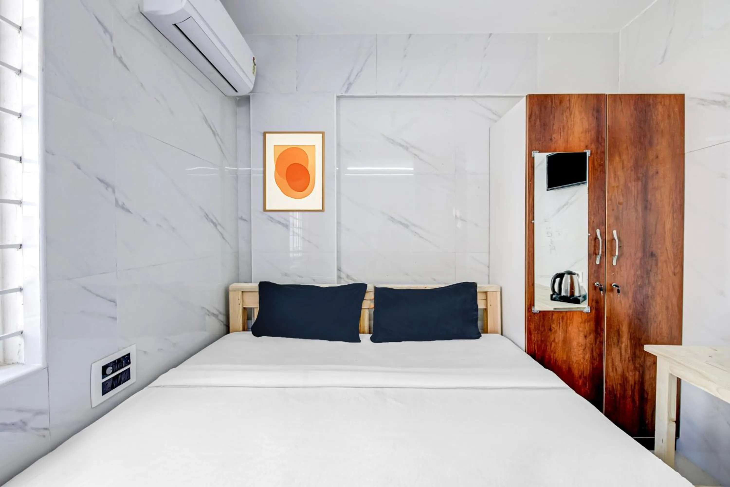 Bedroom in Collection O Sapthagiri Inn