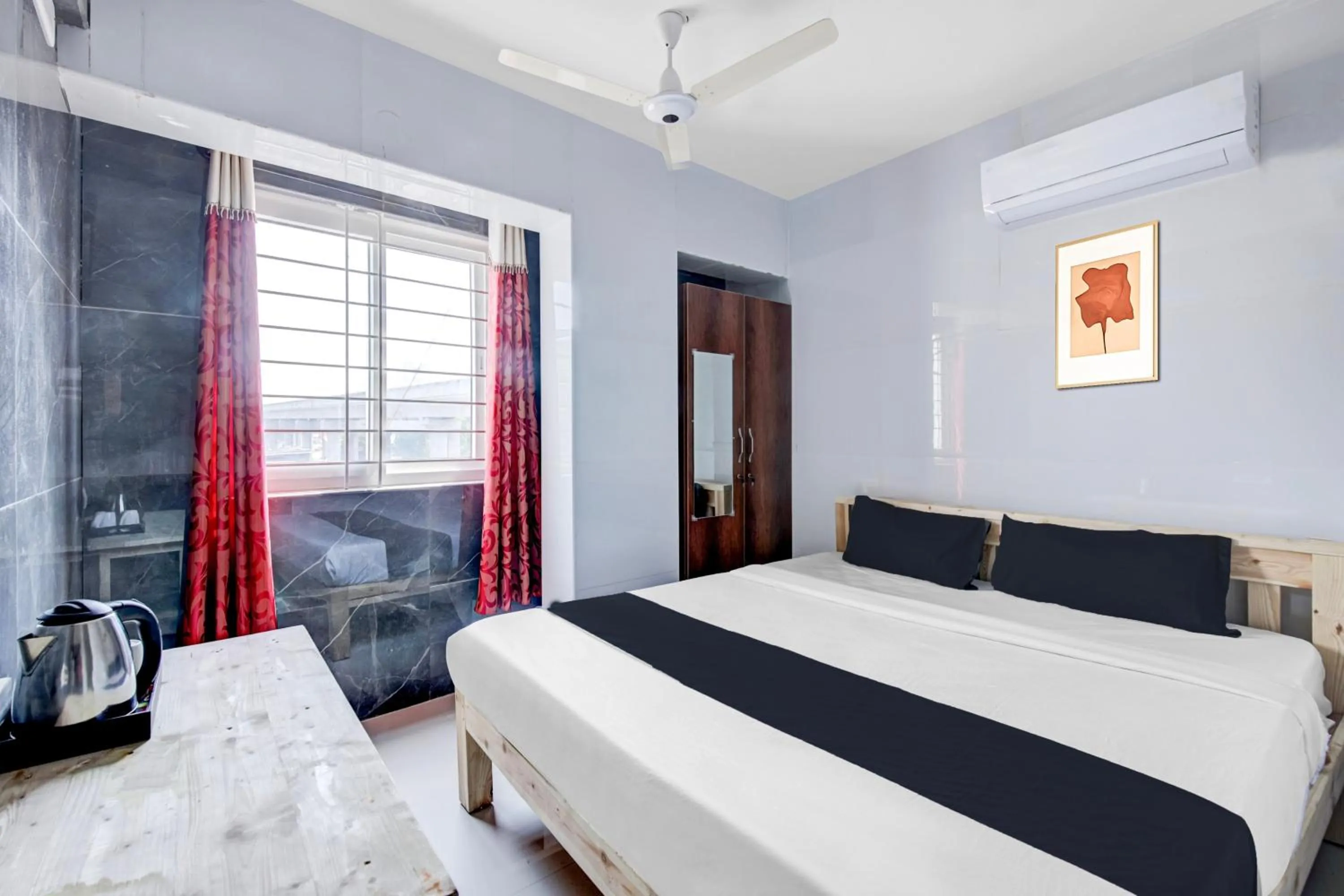 Bedroom in Collection O Sapthagiri Inn