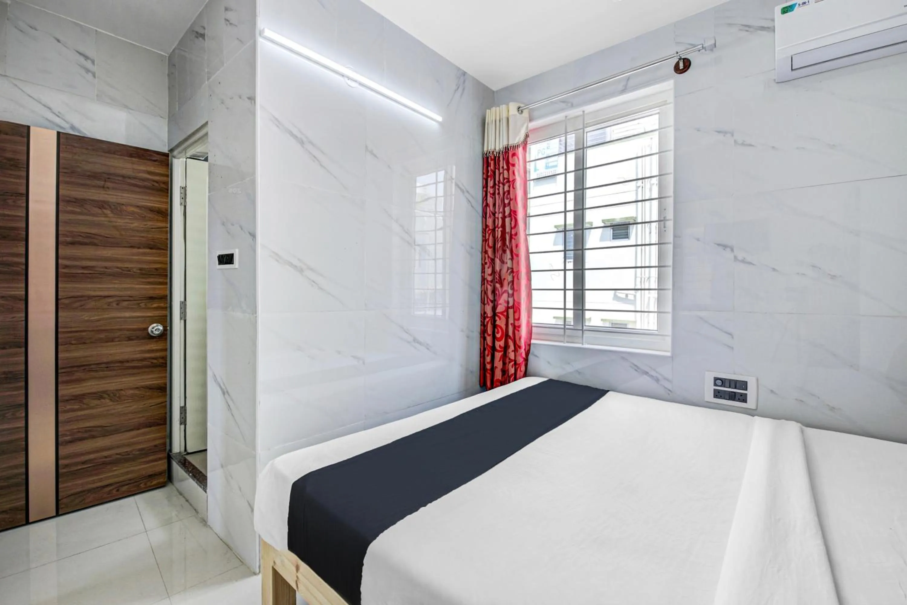 Bedroom in Collection O Sapthagiri Inn